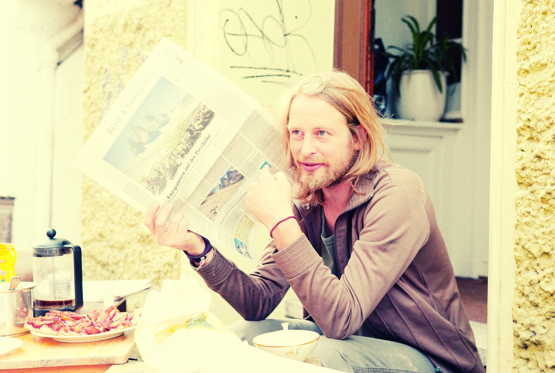 A newspaper is hardly something to hide a secret-telling with...