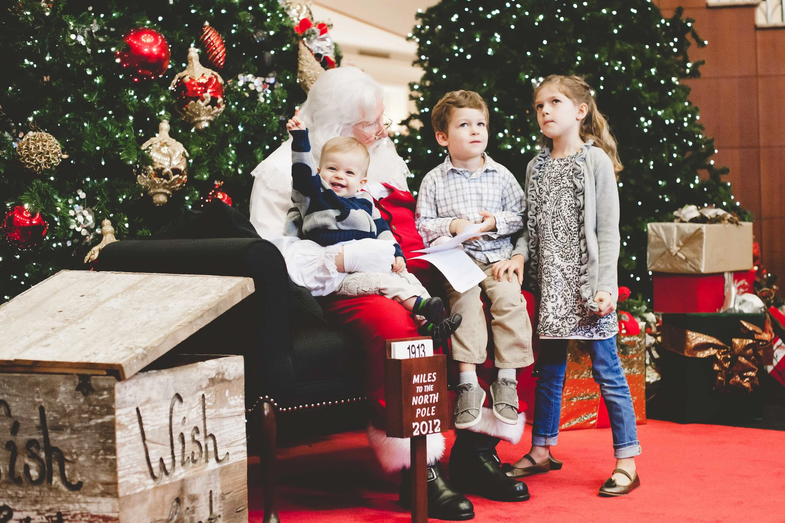 Favorite Santa photo ever. Santa had just finished singing 'Happy Birthday' to Henry because his birthday was the next day. LOVE. 