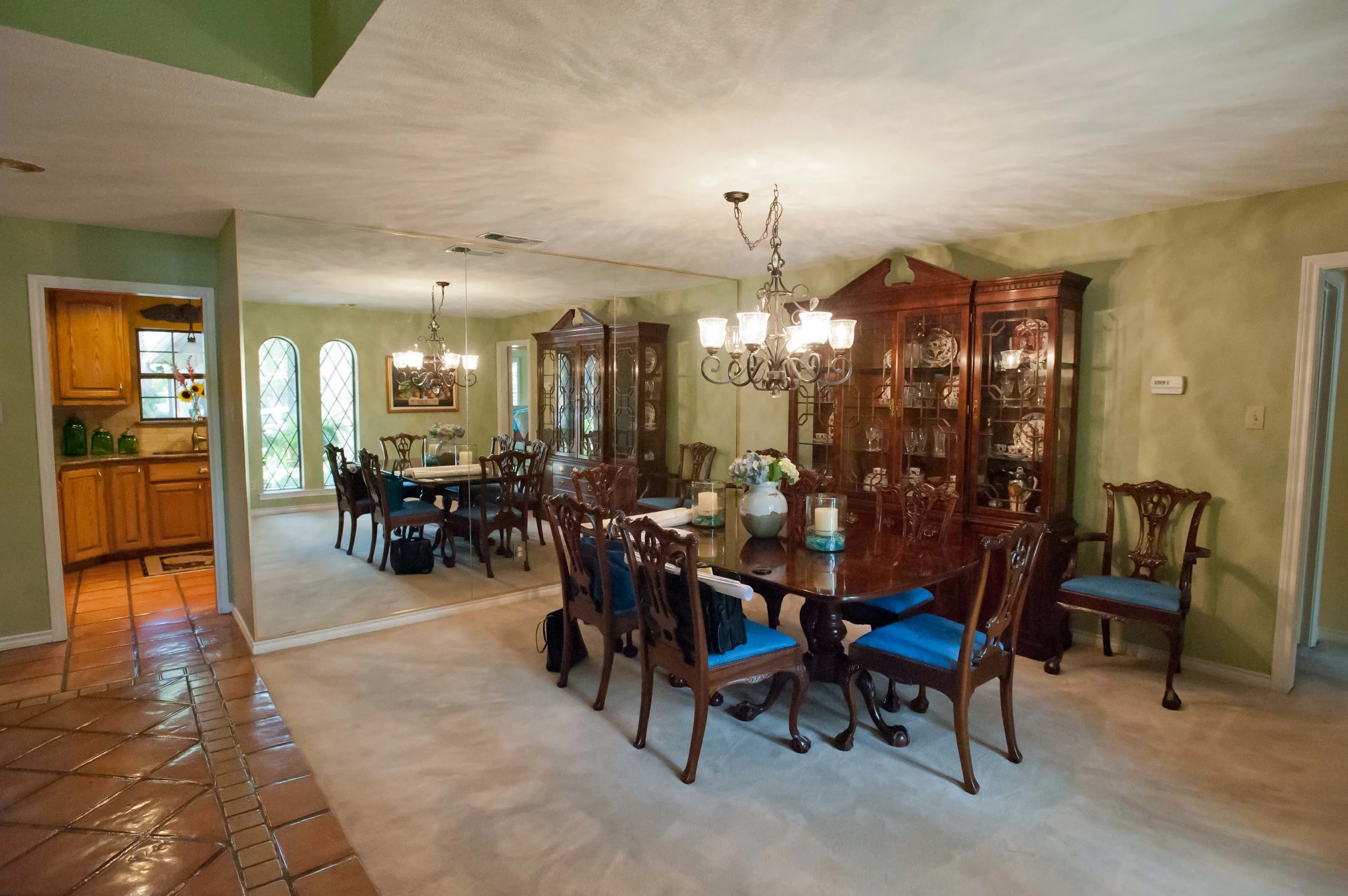 Before: Mirrored wall, carpeted dining room and Saltillo-tiled entry through to the kitchen.&nbsp; ​