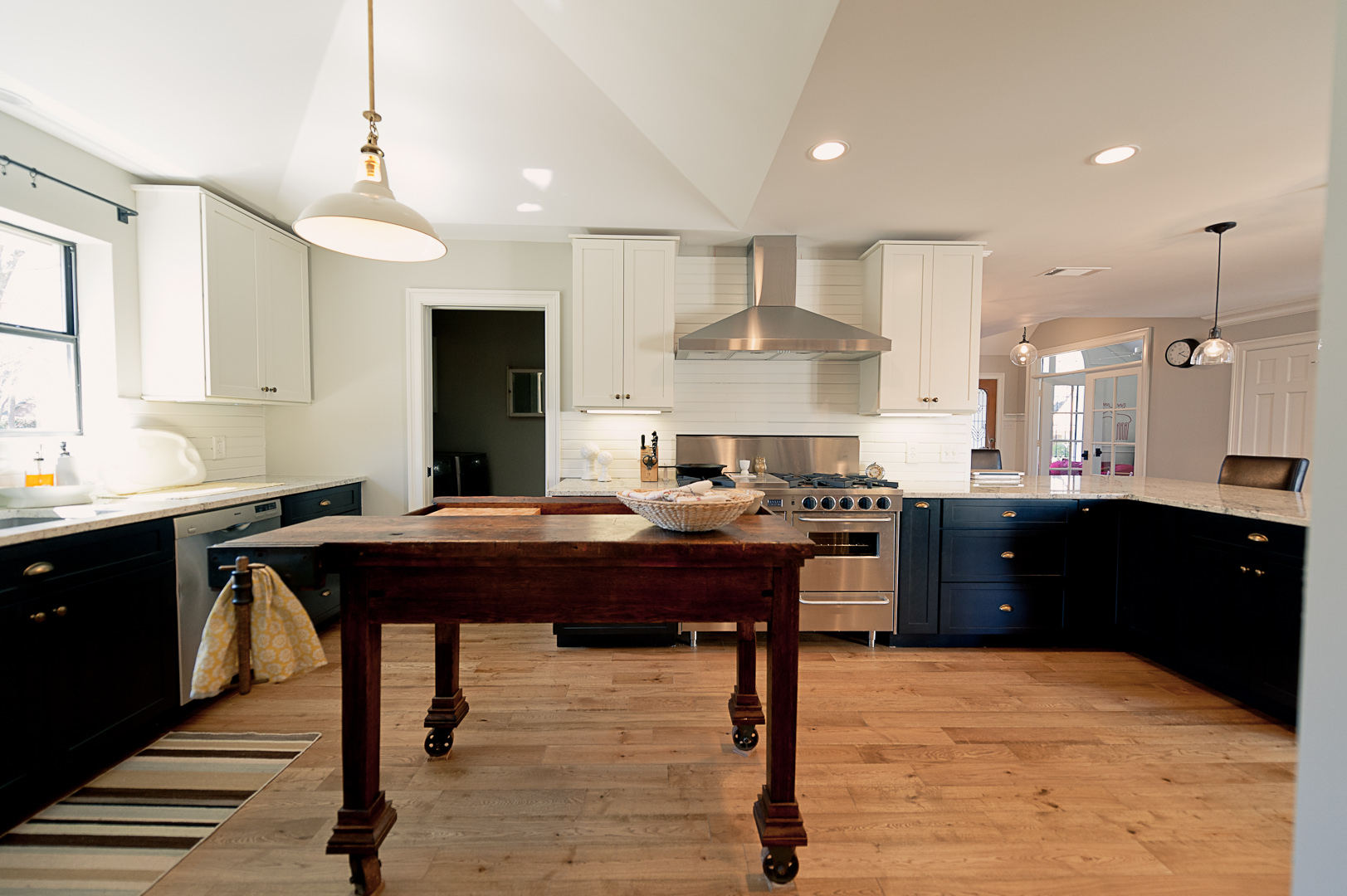 After: A portion of the wall with the ovens was removed to make room for a peninsula countertop.&nbsp; We also took out the header between the former kitchen and breakfast area to open up the space.&nbsp; ​