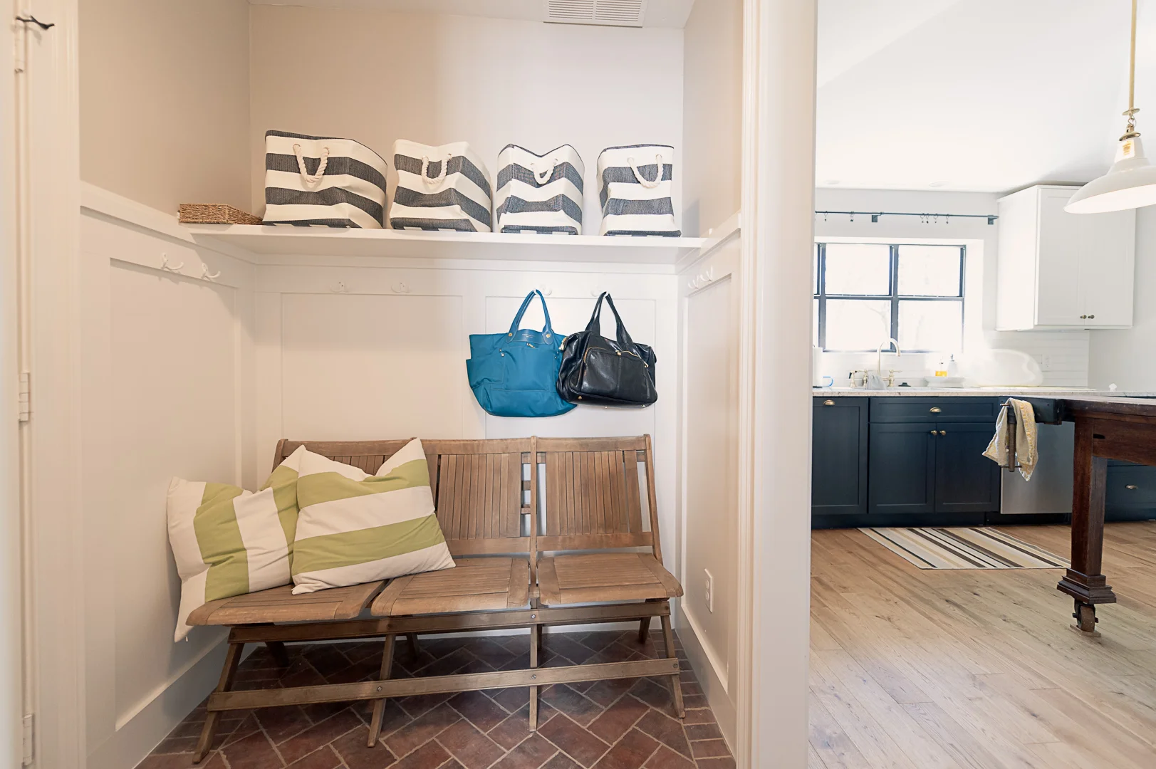 Outside the bathroom is the mud room/hall.&nbsp; Our trash cans now have to live outside the garage, but we're good with the trade-off.&nbsp; It won't hold all of our coats and junk the way our old mud room did, but it's still a nice space to handle…