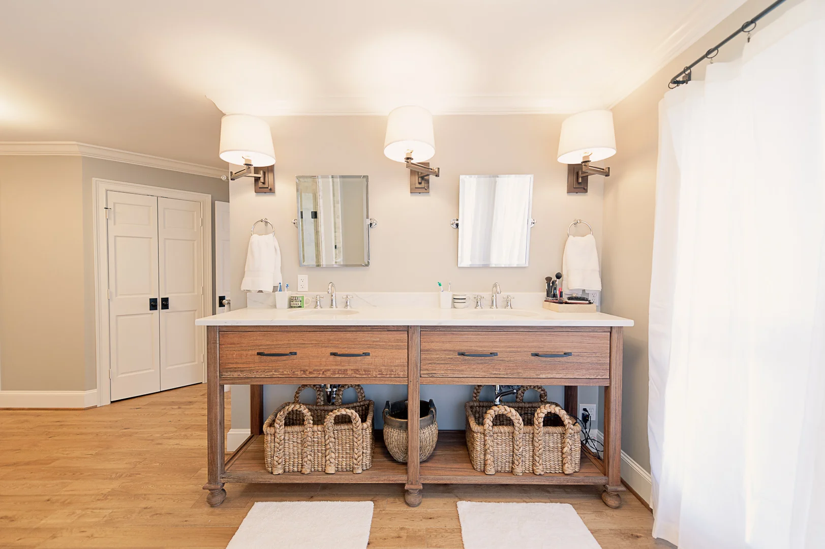 After: My favorite piece of furniture in the house, beautifully built by my dad and inspired by one in a Pottery Barn catalog that didn't fit the budget.&nbsp; ​It sits where the mirrored wall once was.&nbsp; We also took out the high, glass-block w…