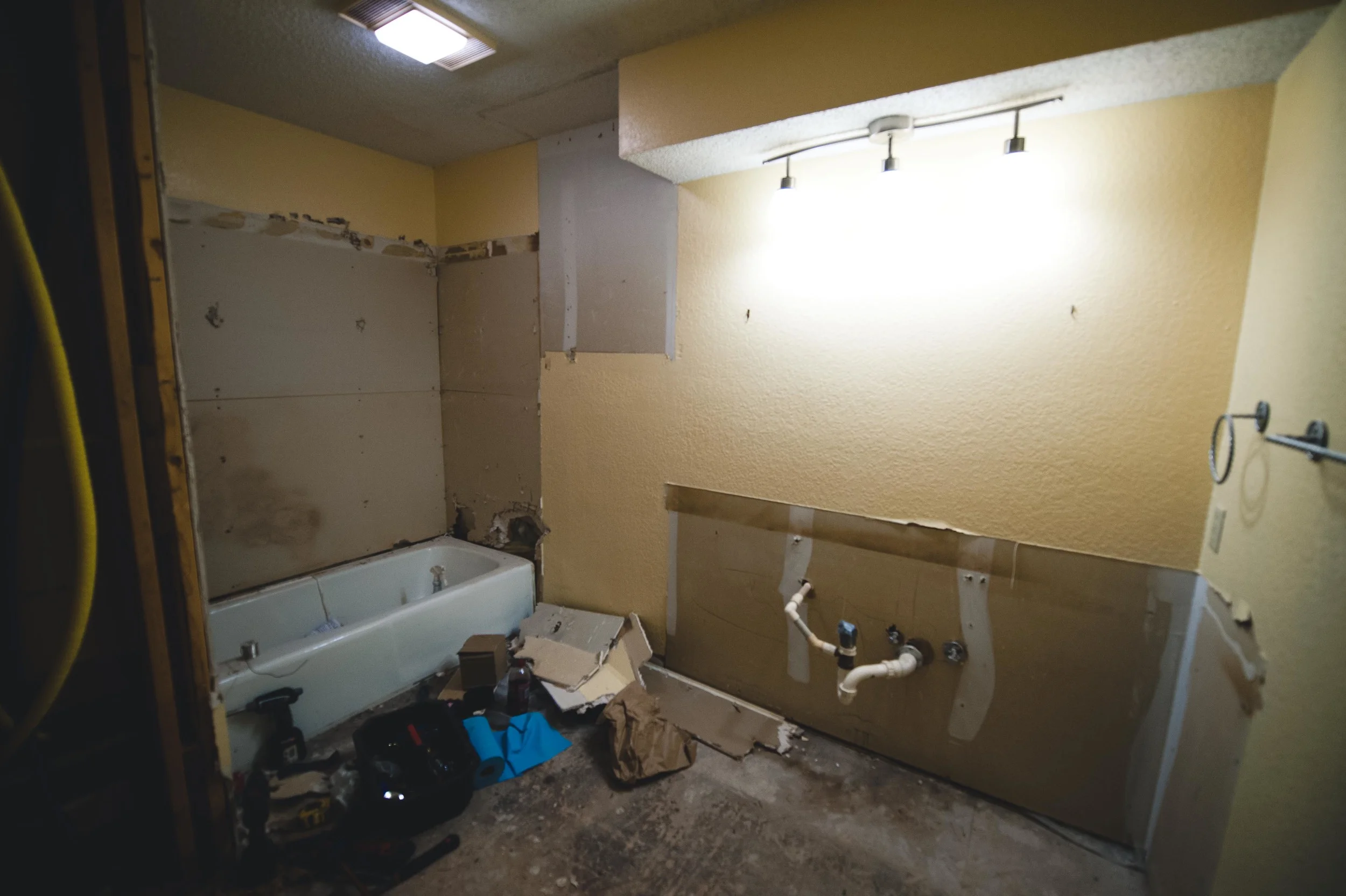During: We saved the tub, but lost the over-potty cabinet, the lighting bulkhead and, well, everything else. ​