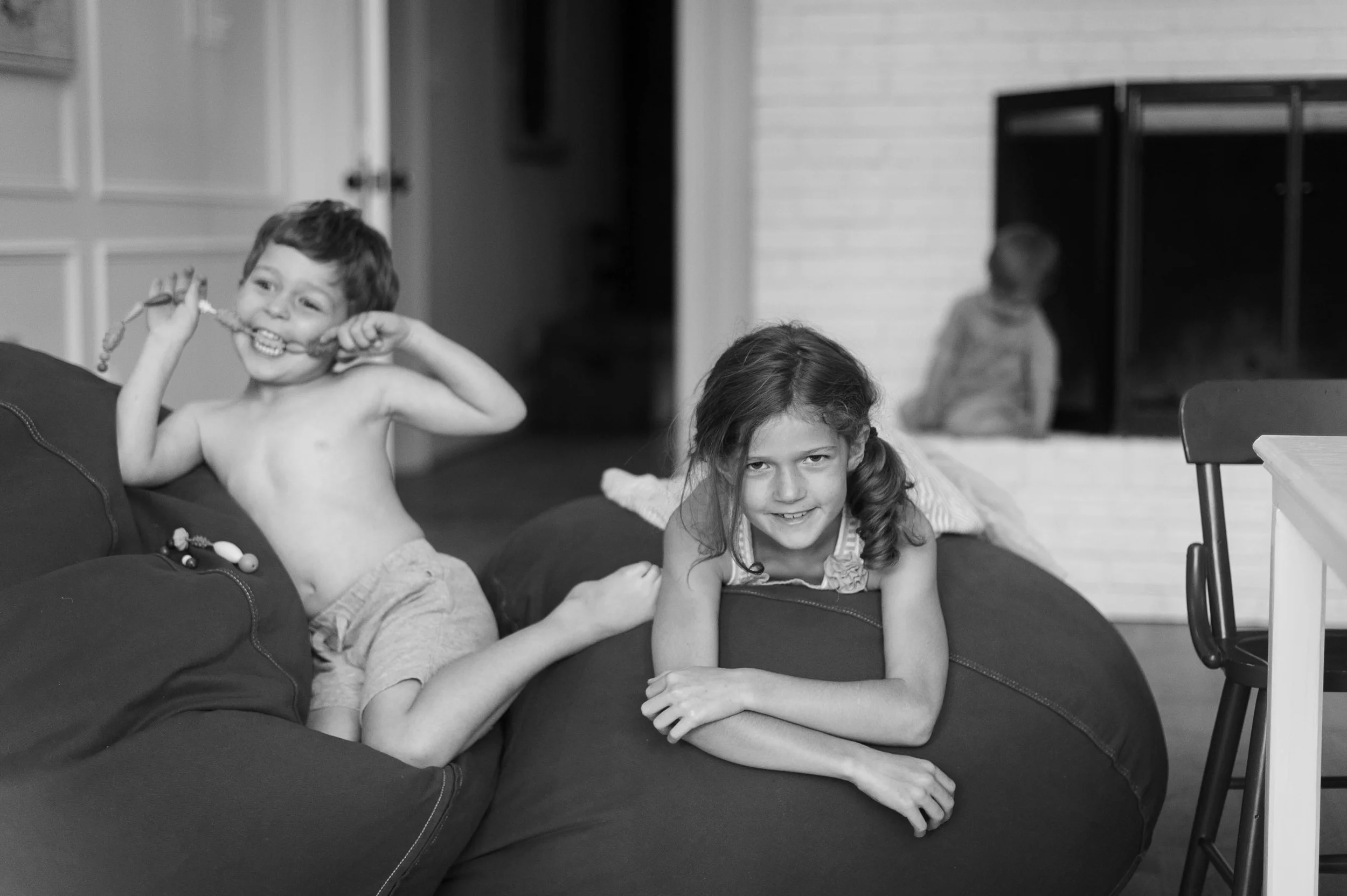The craziest thing happened while I was taking pictures. The kids began ASKING me to take their photo and even took over telling me where to shoot from and what to take. Actually arguing over who's turn it was. Insanity. Yes, these are the same kids that I bribe with treats to cooperate with mom's camera on a regular basis. Here are their true personalities in authentic form...goofball Michael, grown-up Ella and getting-into-trouble-while-everyone-else-is-distracted Hank.