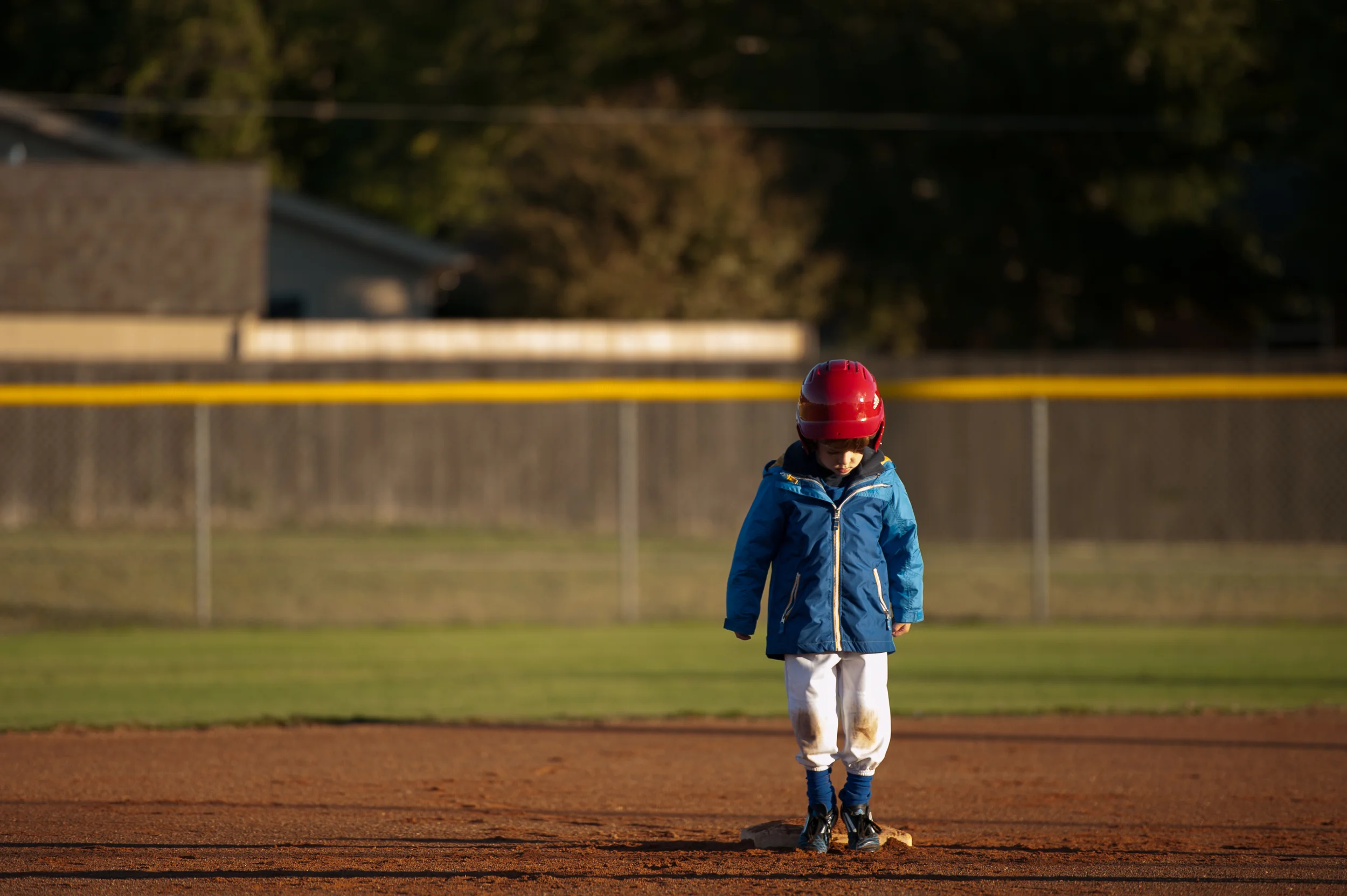 Even the time it takes to stand on base while waiting for the next batter to do his thing is too much time for Michael to stay focused and not get distracted by all of the awesome dirt on the field. We hear this improves. 