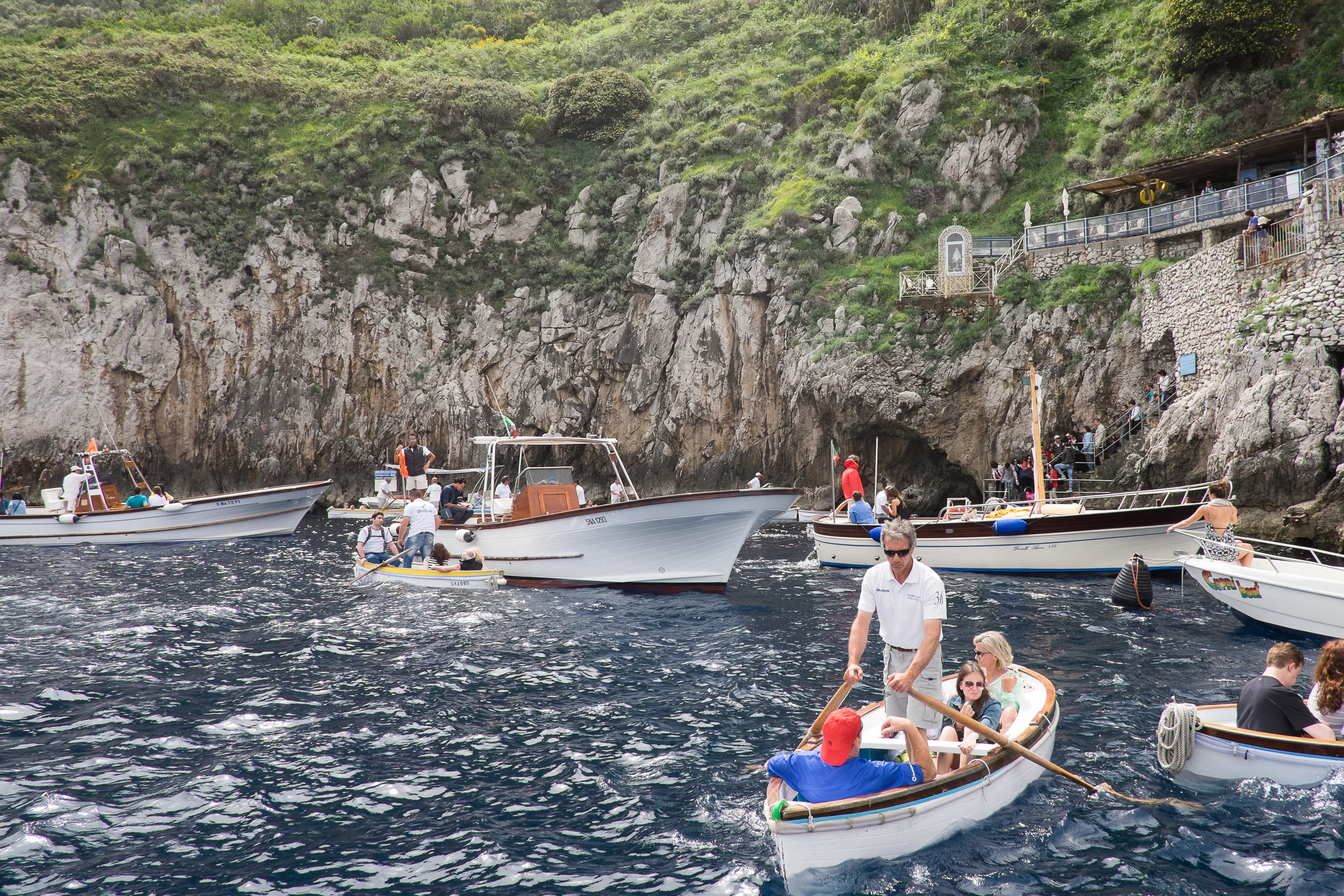 Queuing to go into the Blue Grotto -- getting in and out of the little dinghy was a fun little adventure.