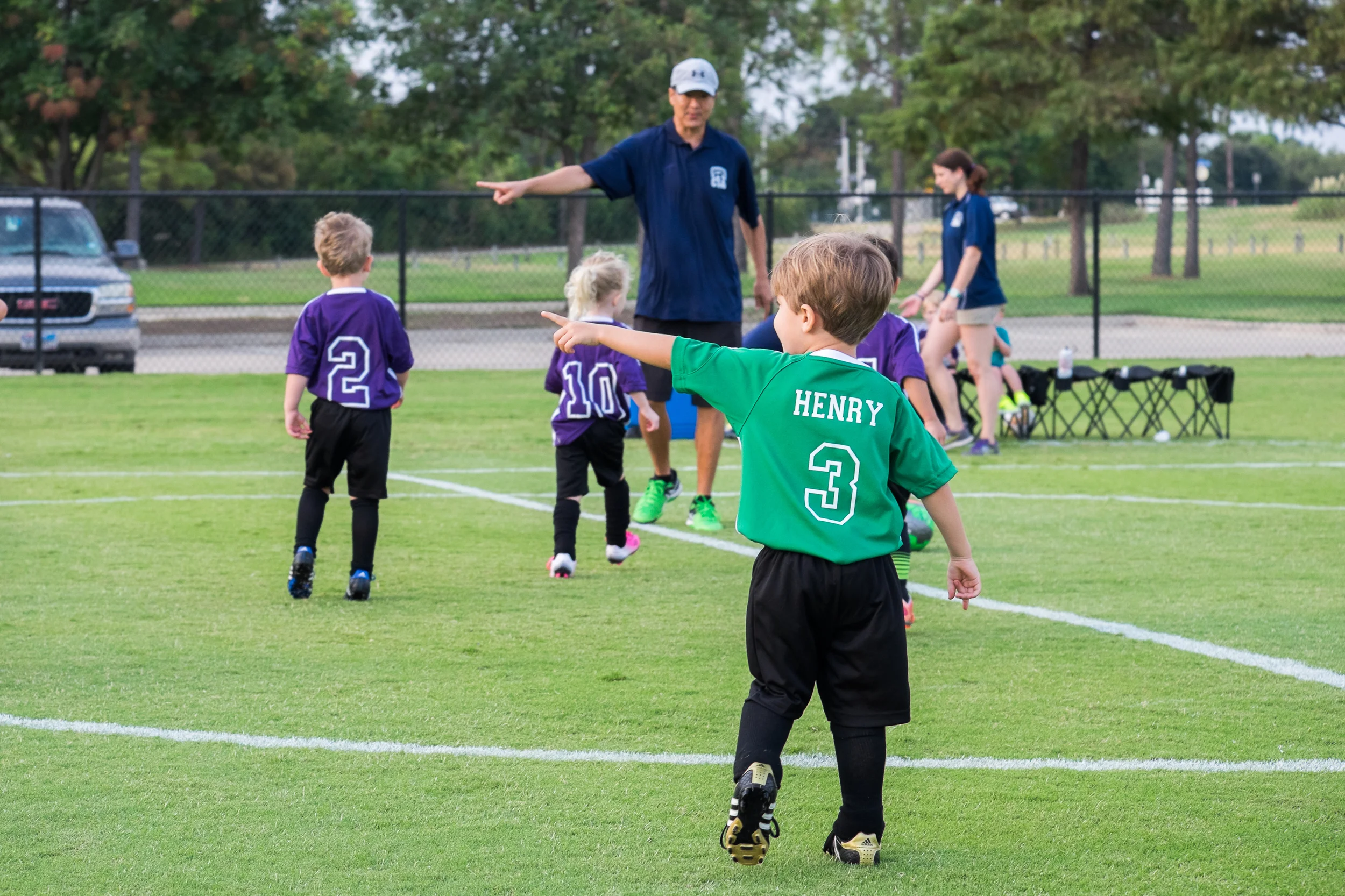 Note, Henry and the opposing team's coach are both pointing the same direction.