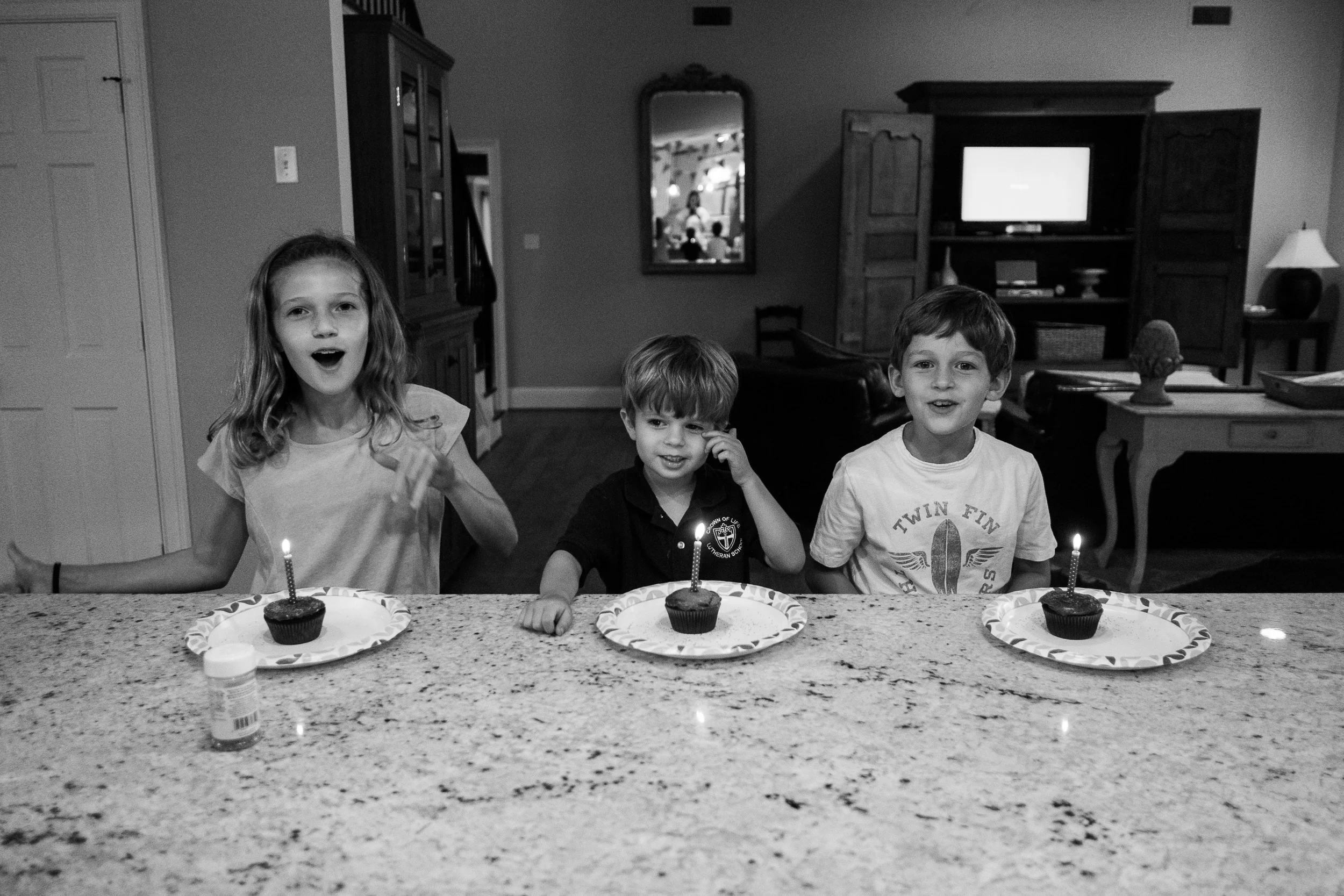 With the friends and family parties not happening until the weekend, we celebrated Michael's actual birthday with cupcakes after dinner.&nbsp; Naturally everyone had to have a lit candle.&nbsp; Wishes all-around!