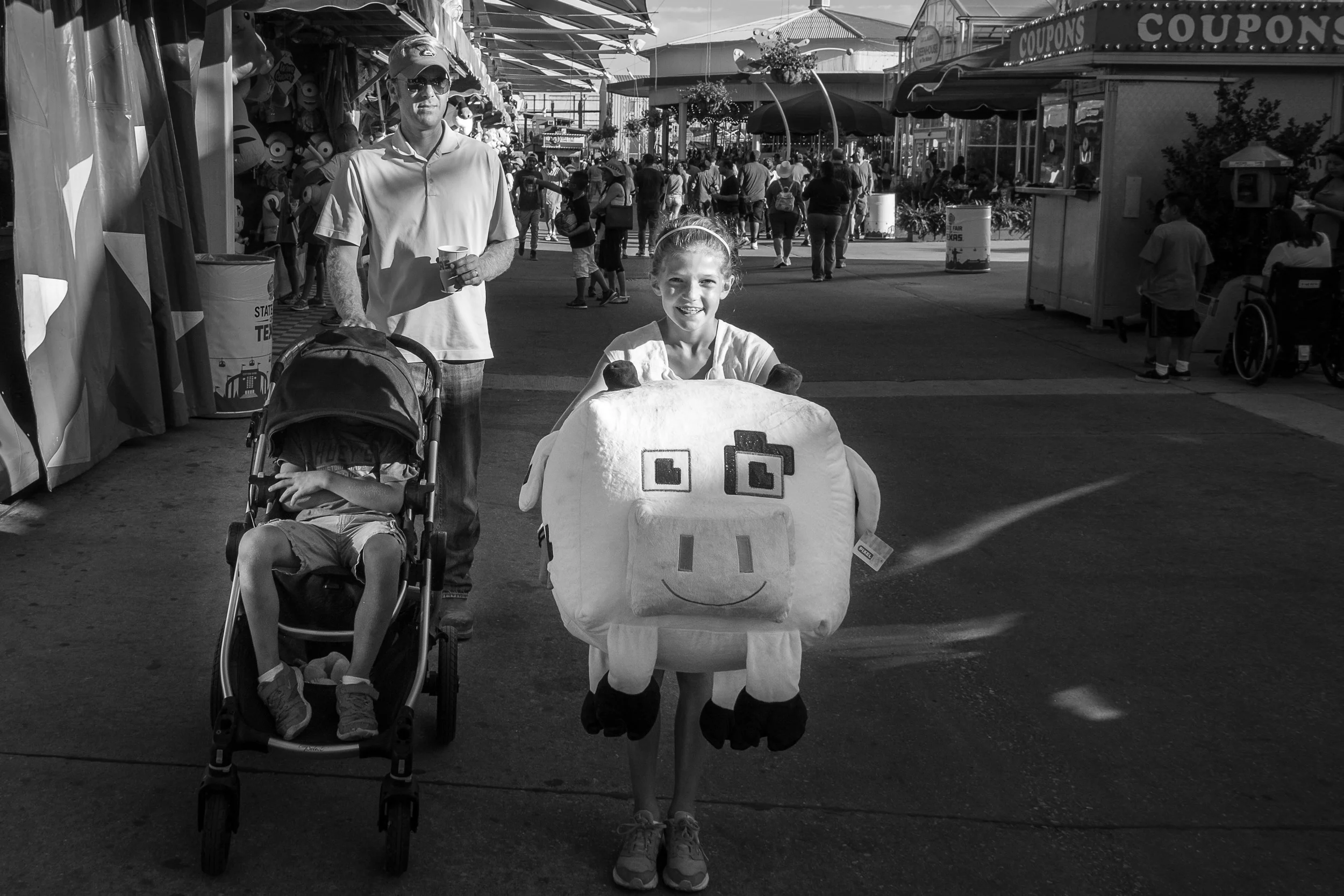 Ella won this massive Minecraft cow. Two things about this photo make me giggle.&nbsp;1. Knowing how Ella is going to have to haul that thing around the fair for two more hours.2. Her brother's temper tantrum while sitting in the stroller he's clear…