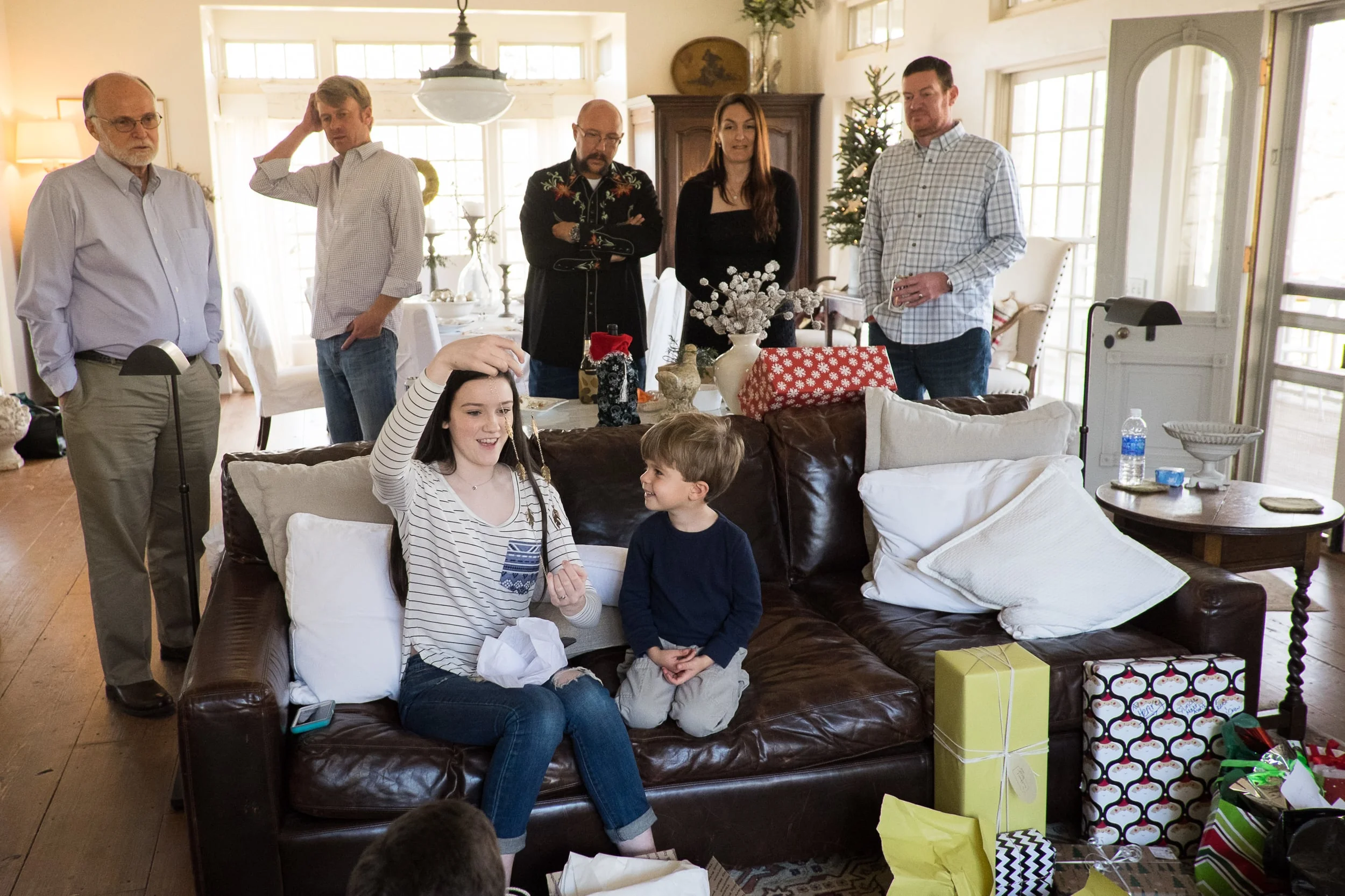 You know four-year olds. If anyone -- anywhere -- is opening a present, they are there by their side.