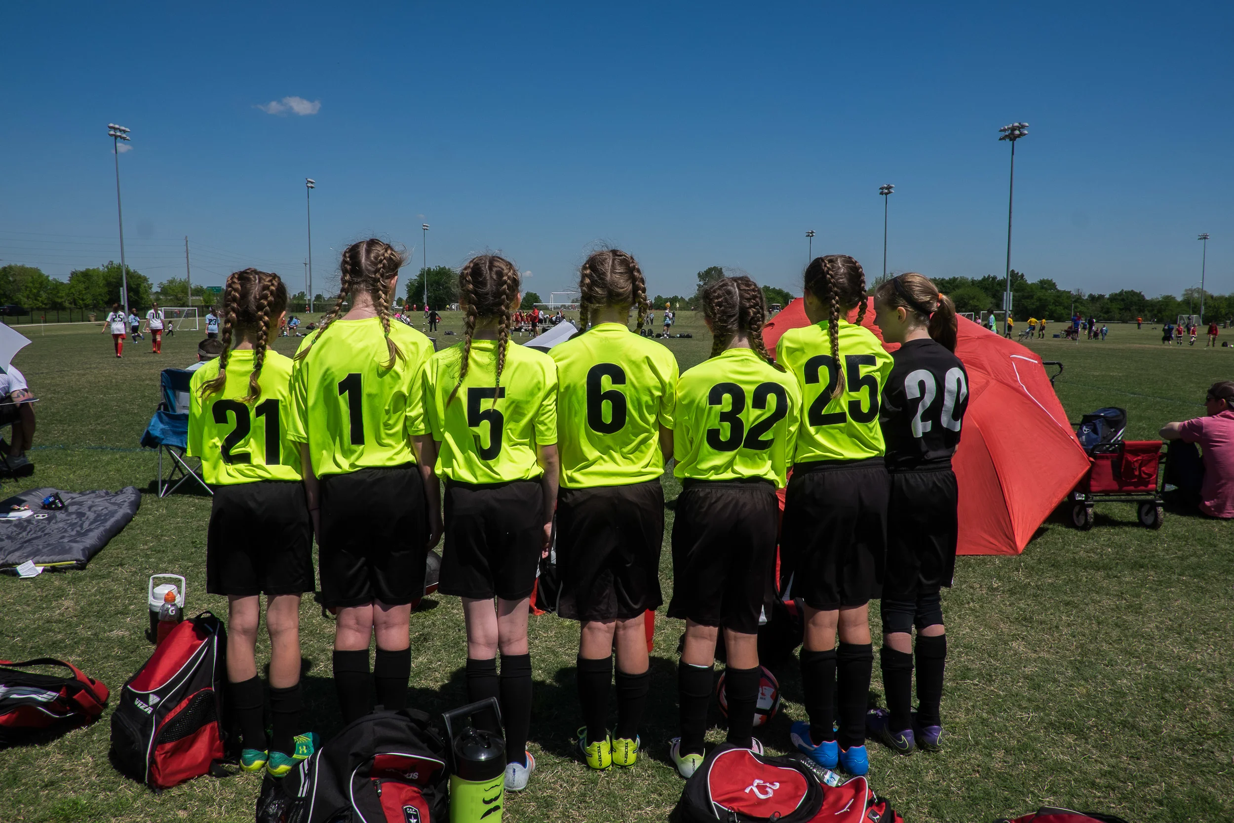 Following the end of the regular season, Ella's team competed in their first travel tournament. Several of the team members wore double French braids the first day which was a great idea until it came time to cheer them on from across the field -- and we couldn't tell who was who!
