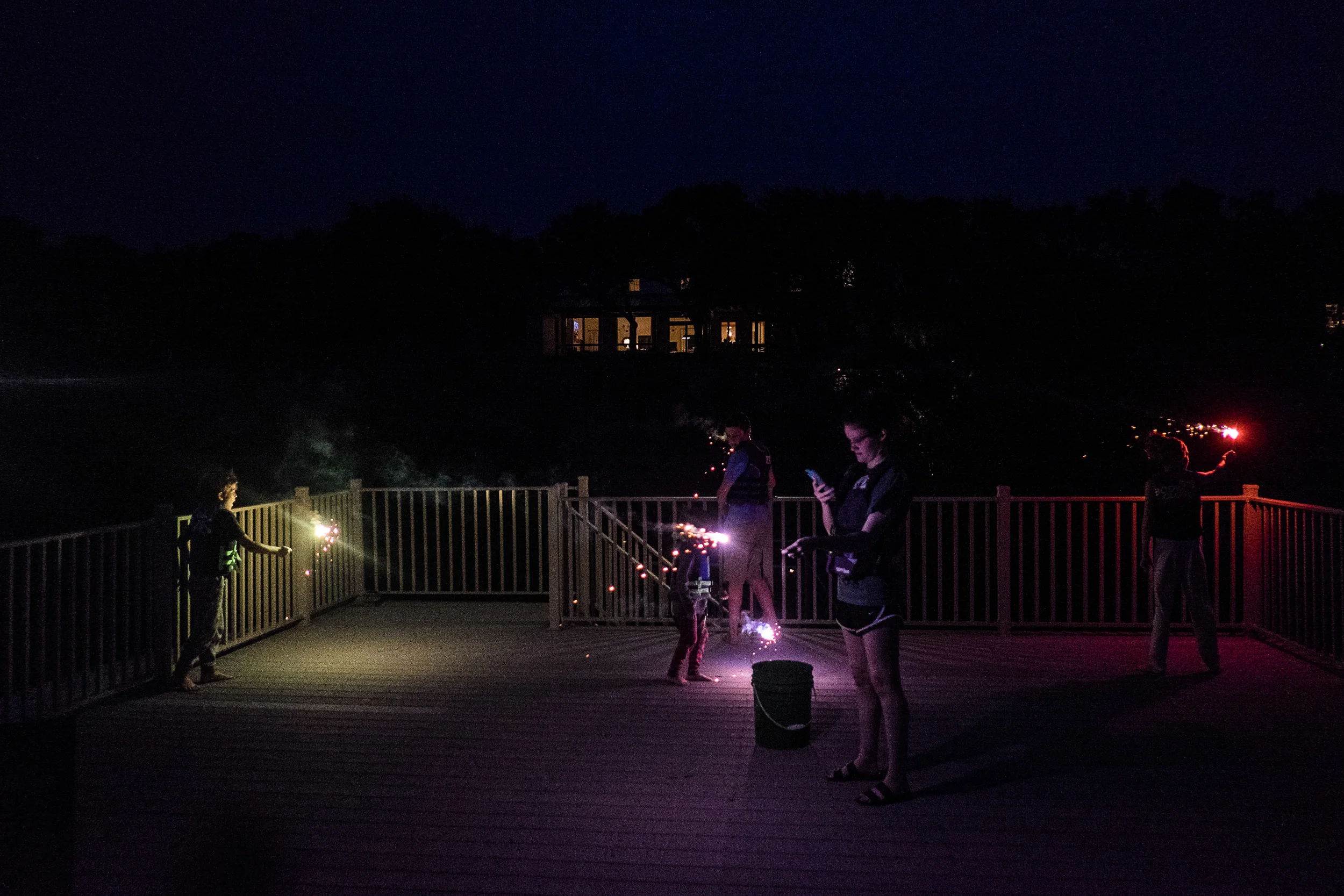 One drawback to watching July 4th fireworks from a floating dock deck is not being able to set a timer to capture the actual fireworks. Maybe next year I can convince everyone to watch from dry land. Maybe. (Note the 15-year old Snap-Chatting her burning sparkler in the foreground. We know Ella is right behind her!) 