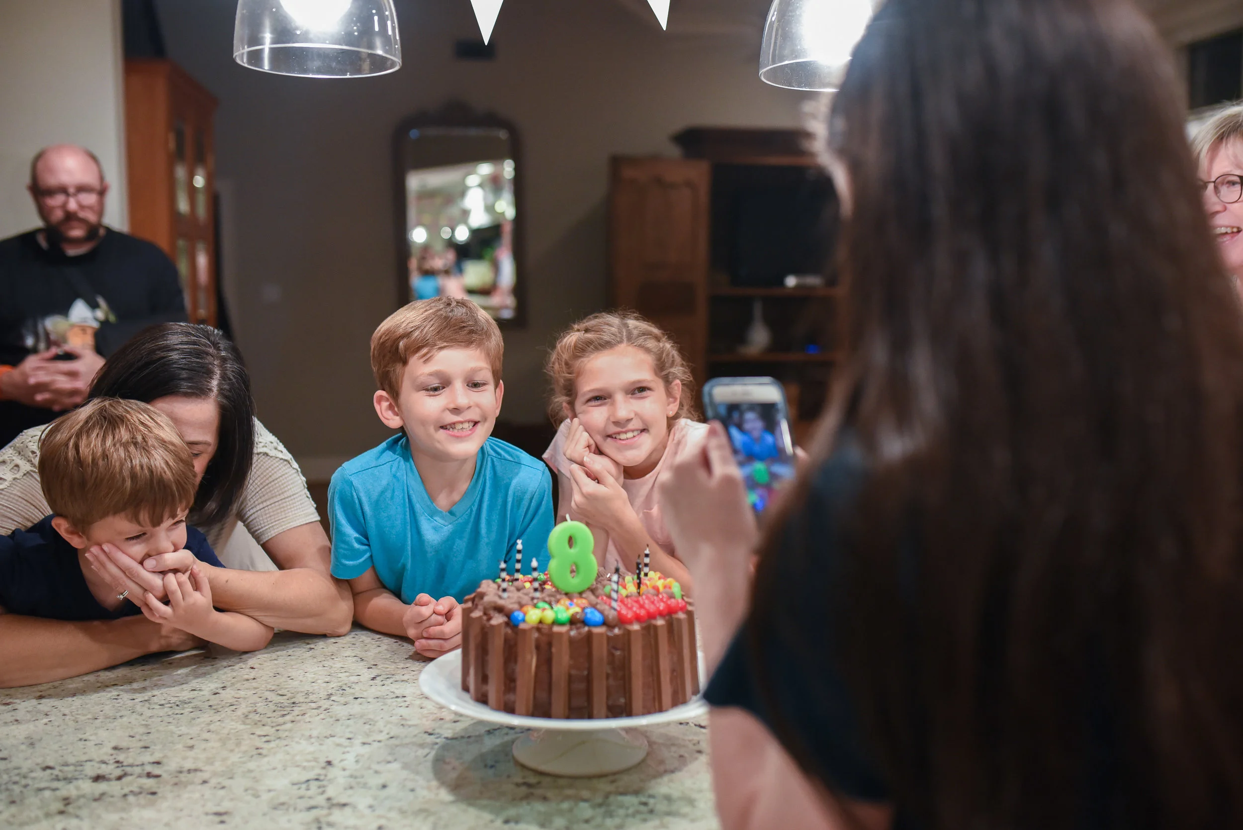 Once again, Aunt Amy comes to the rescue, keeping pesky little brother from big brother's cake.