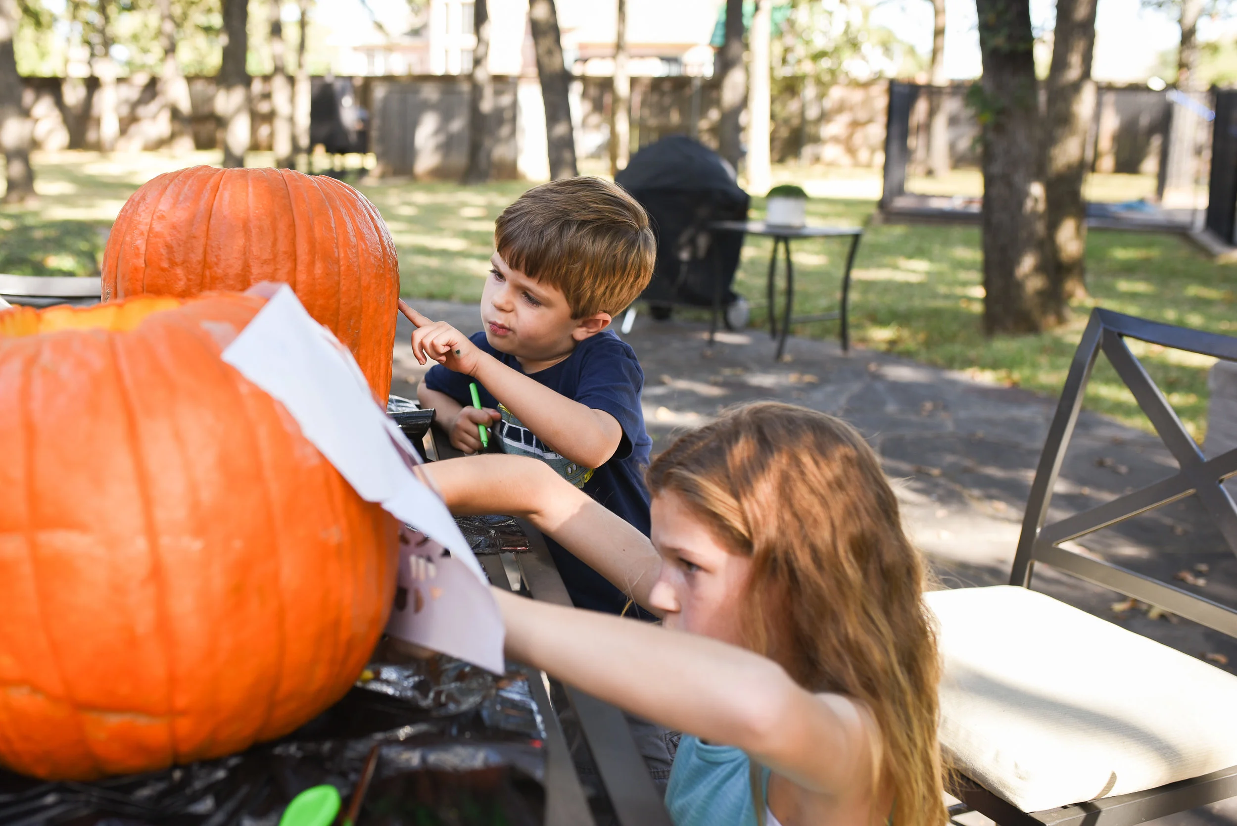 Since we celebrated Halloween on a crazy busy Saturday, carving our pumpkins waited until Sunday. Henry took his creative duties quite seriously. 