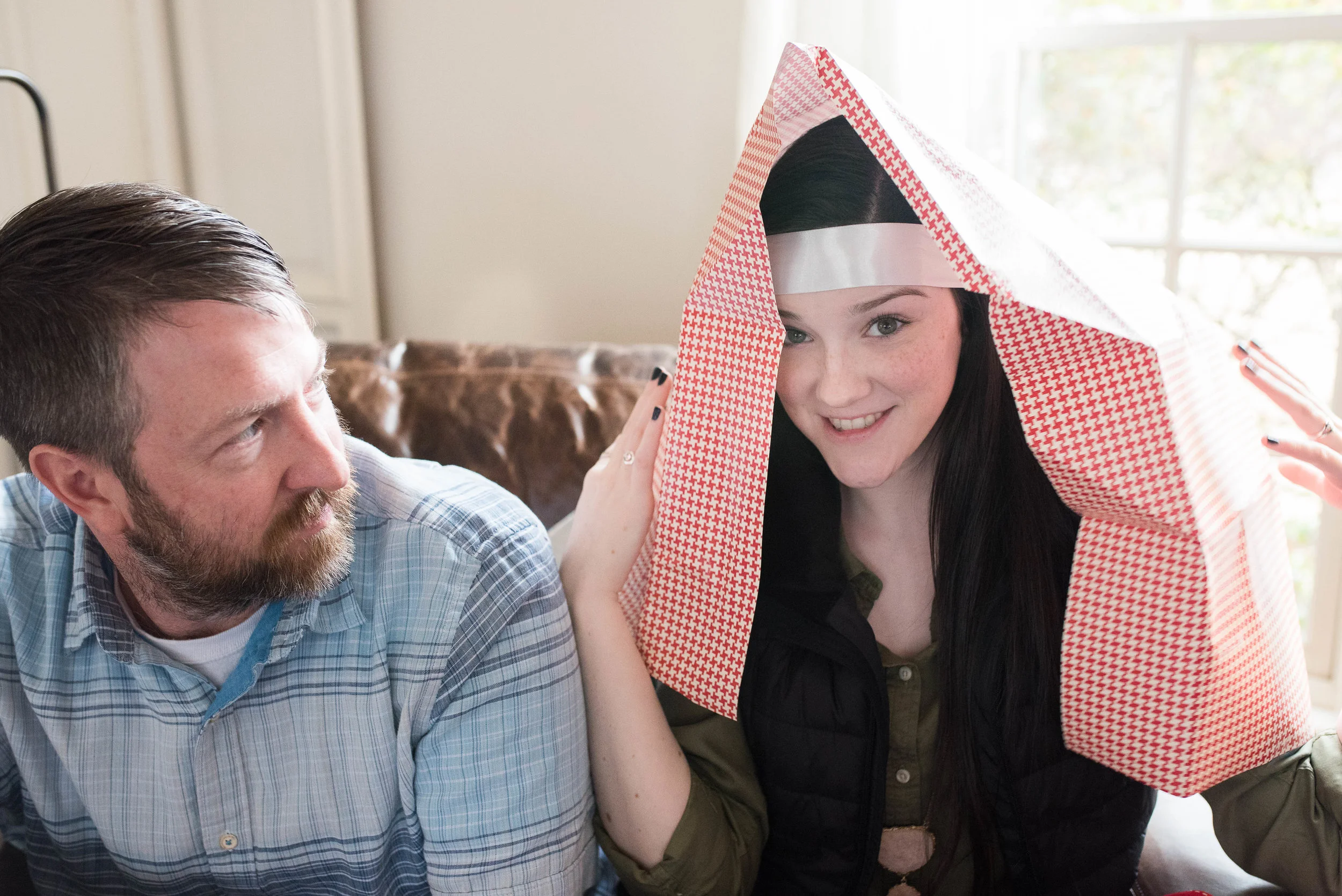 When waiting your turn, feel free to turn gift wrap into costuming. Kate makes it work. 