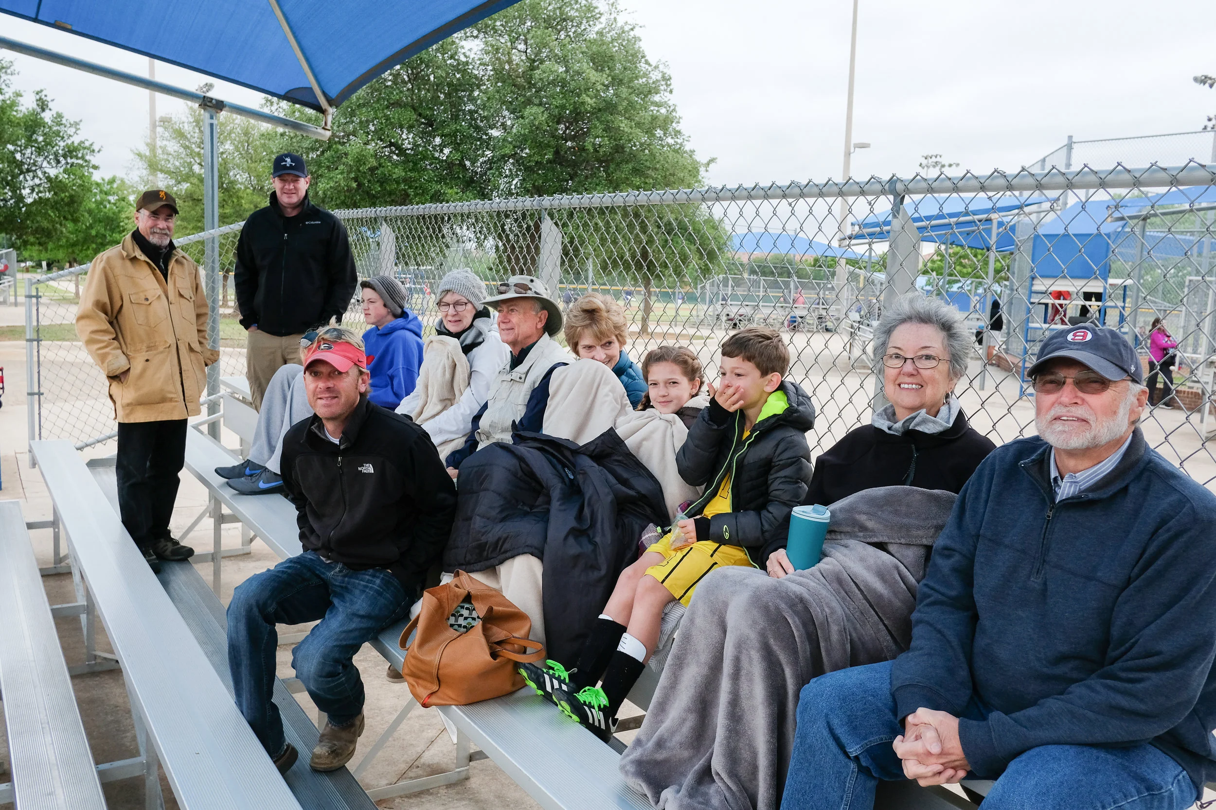 The big kids pretend it's embarrassing when twelve people show up to cheer for them. But Henry basks in the limelight, waving to his many (frozen) fans as he runs the T-ball bases. 