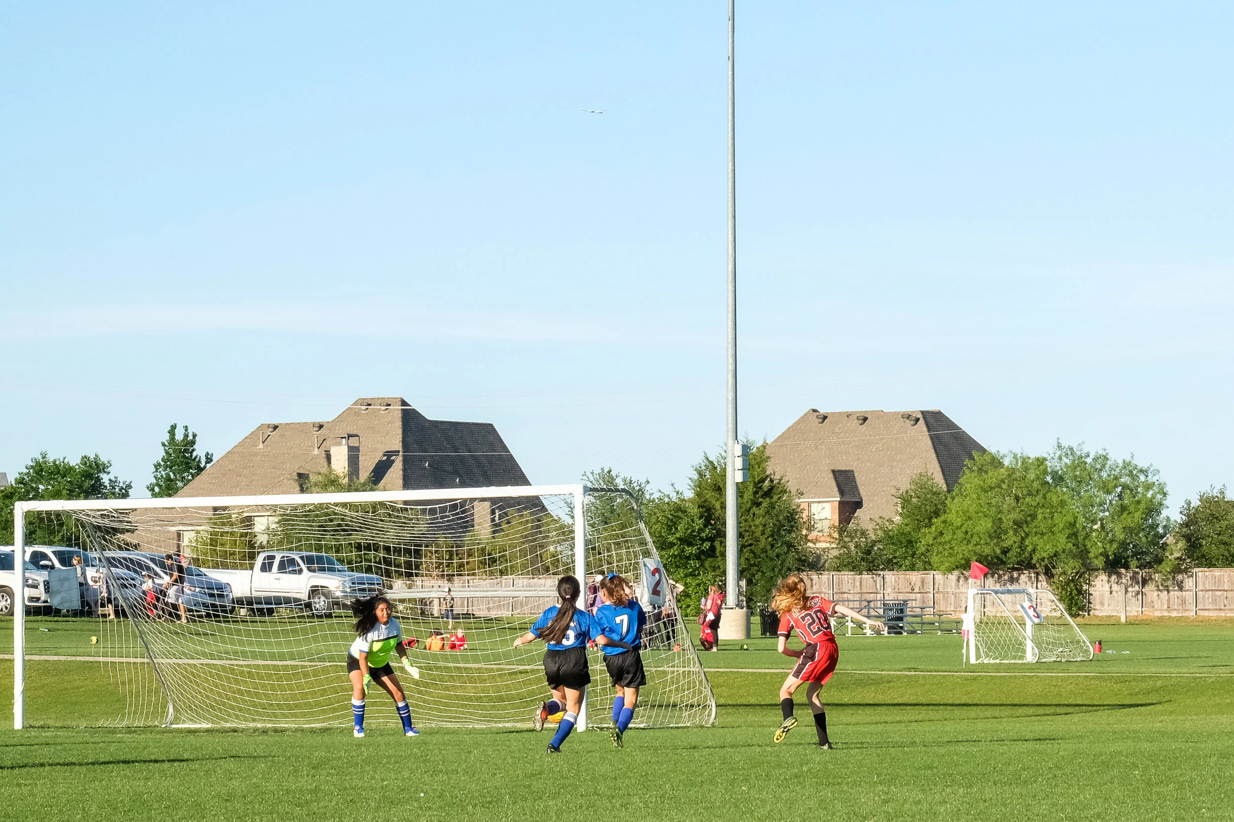 It's hard to see, but the ball is going right past the post, avoiding both defenders and the keeper, on it's way to the net. Gooooaaaaaaallllll! Yes we are obnoxious parents. (She also had two assists.) Like, really obnoxious. 