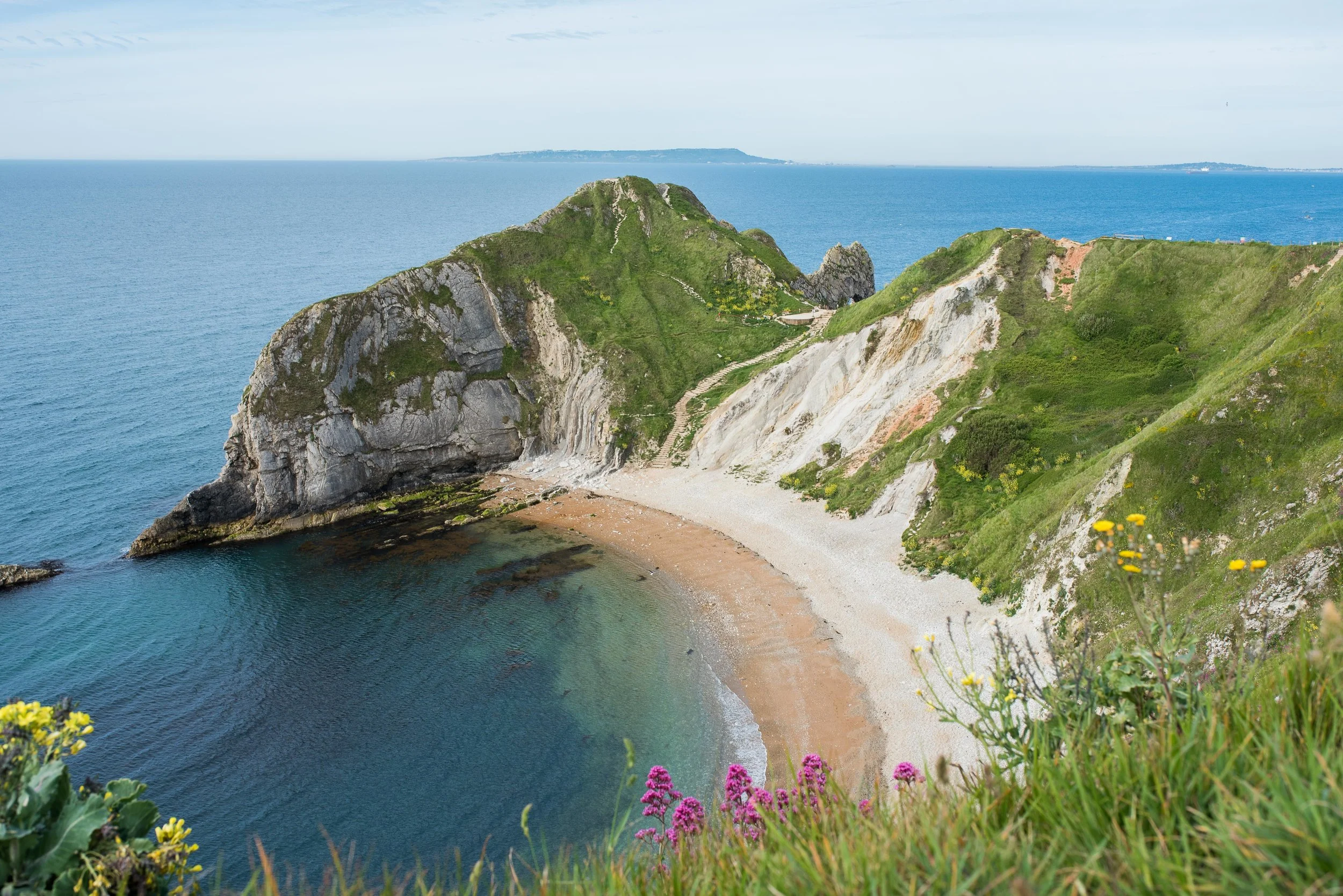 Okay. If Sue would have said, "This is it!" I would have been completely happy, snapped about 100 photos and trotted back up to the van. But instead, she laughed at how long I was lingering on this side of the peninsula and said, "You realize we haven't even gotten to the Durdle Door part yet, right?"