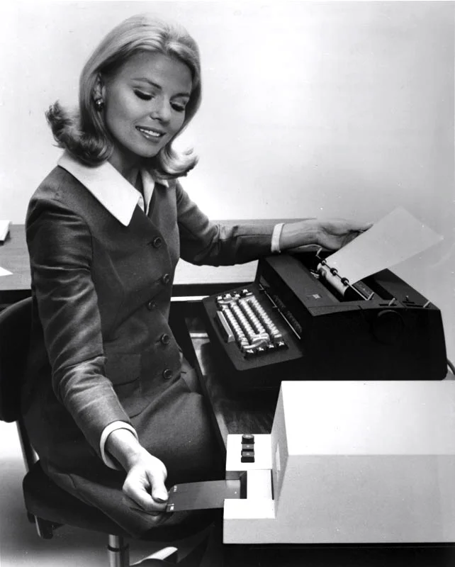 Steno pool girl with mag card typewriter.