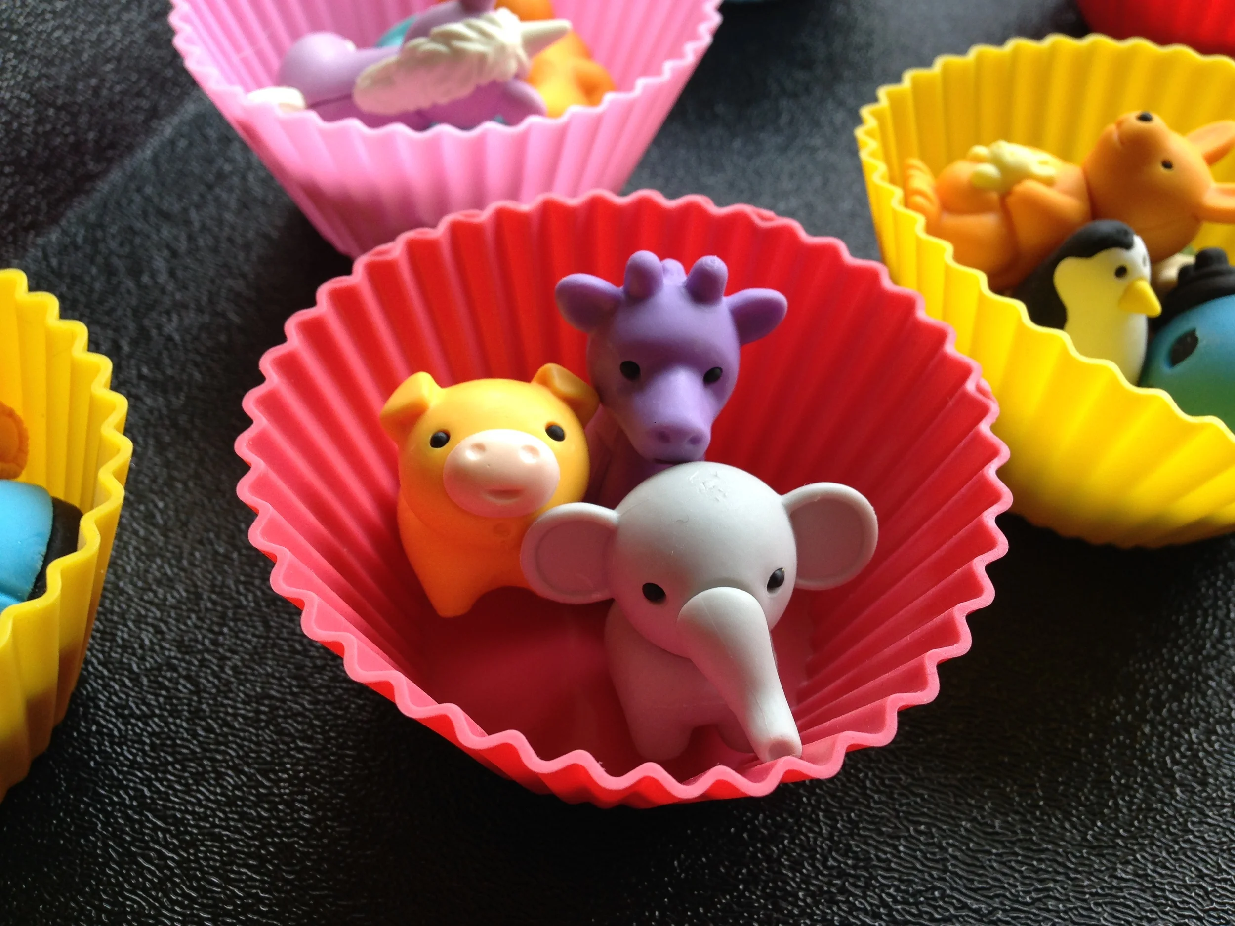 I like to give the students the erasers in these cute silicone cupcake holders . They're bright, lightweight and easy-to-store.