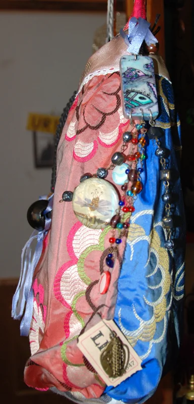 Freda Kahlo colour clash, a donna thing domino label with recipient DOB on reverse, and more embellishment