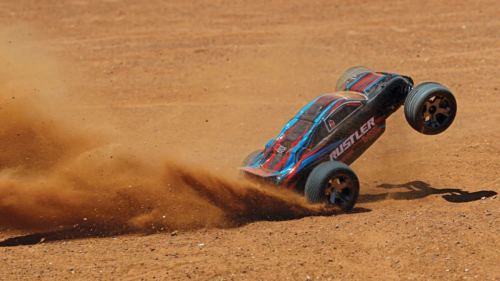 37076-4-Rustler-VXL-Action-RED-Dirt-Rear-Wheelie.jpg