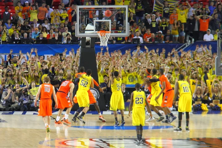 Burke ices the game from the line as Michigan defeats Syracuse in the final game of record for Michigan of the 2013 season.