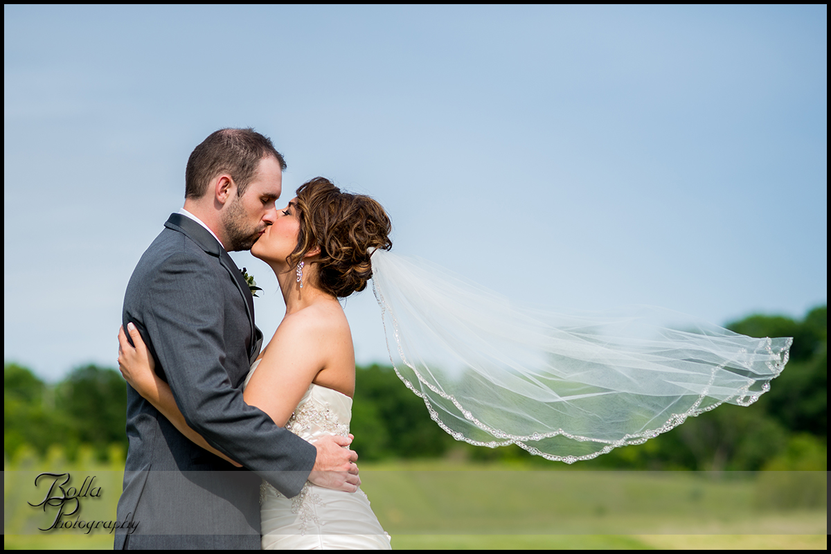 001-villa-marie-winery-maryville-il-wedding-bride-groom-kiss-veil.jpg