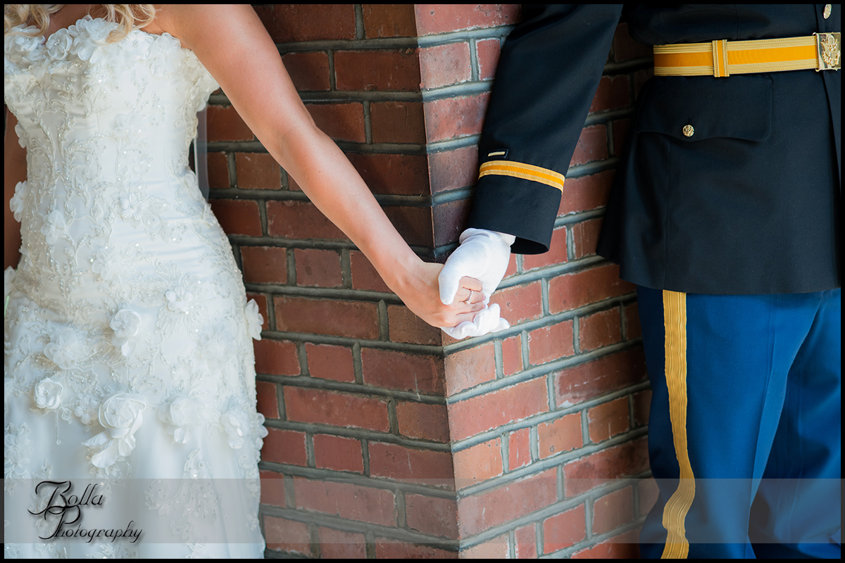 004-provincial_house_chapel-church-saint_louis-mo-wedding-bride-groom-holding-hands-first-look-brick-military-uniform.jpg