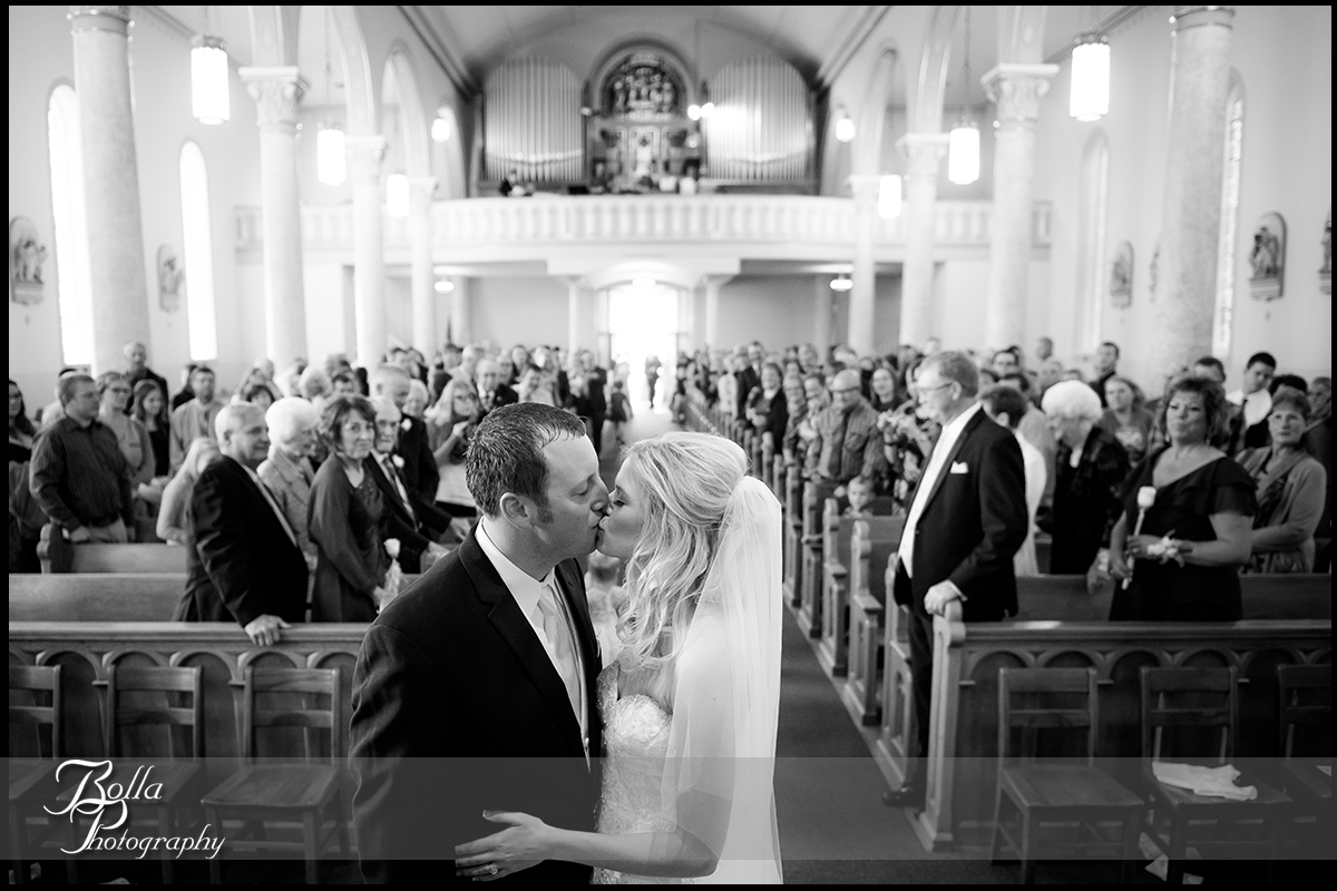 011-Bolla-Photography-wedding-Germantown-IL-ceremony-church-bride-groom-kiss-altar-guests-Albers.jpg