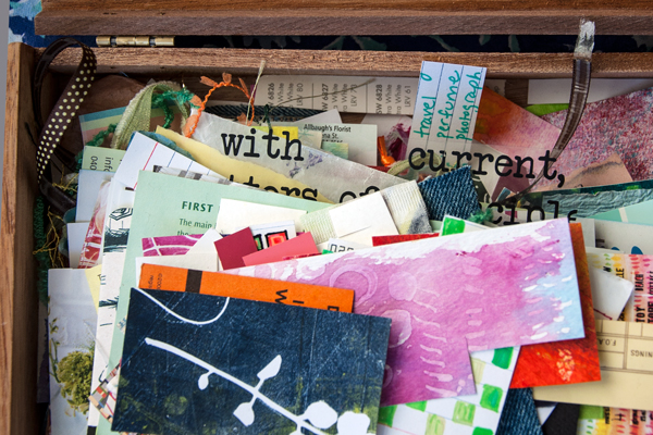 Cigar box with small scraps of papers.