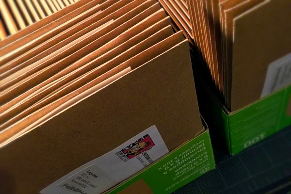 Addressed packages–boxed and awaiting the friendly assistance of the United States Postal Service. May we send one your way?