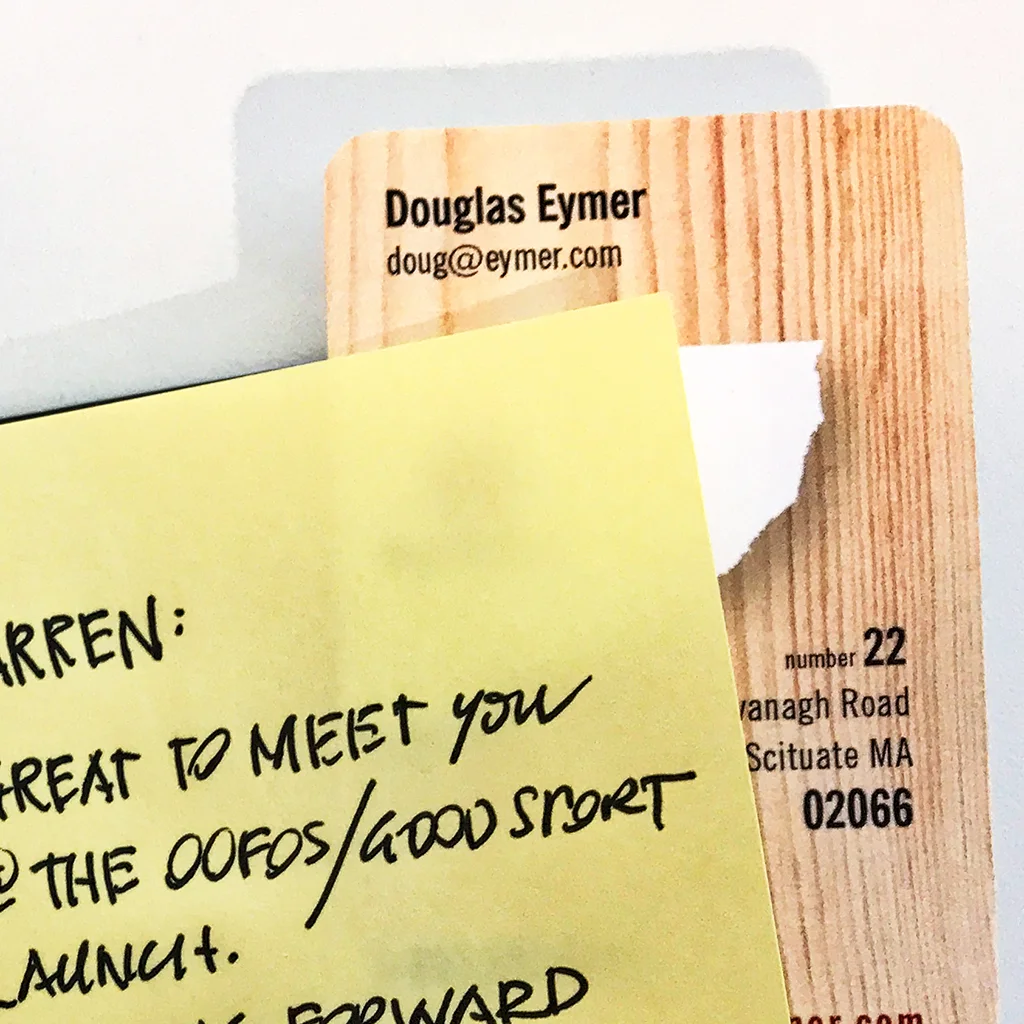 Business card inserted behind the note