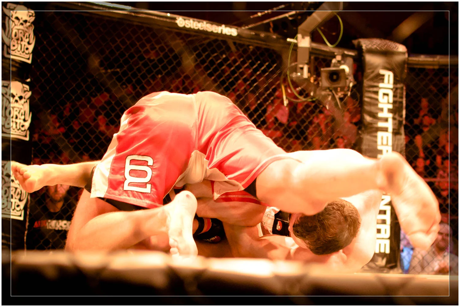 Gregor Herb (white shorts) makes a last second armbar attempt on Sweden's Mats Nilsson (red shorts) in the closing seconds of the match at Zone FC 8: Inferno