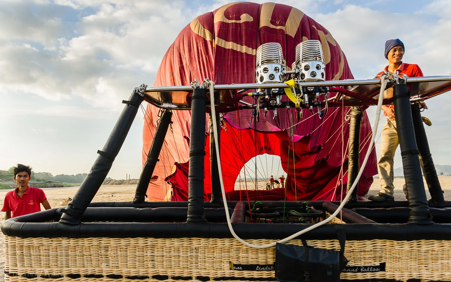 Bringing down the balloon on the banks of the Ayarwaddy after a flight in Bagan. © Dustin Main 2013