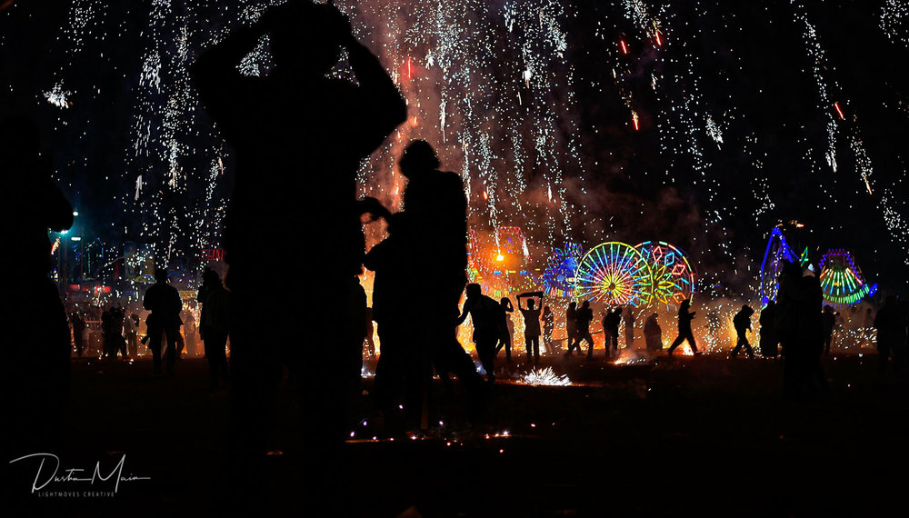  People run for cover at the Tazaungdaing Fire Balloon Festival in Taunggyi.  © Dustin Main 2015 