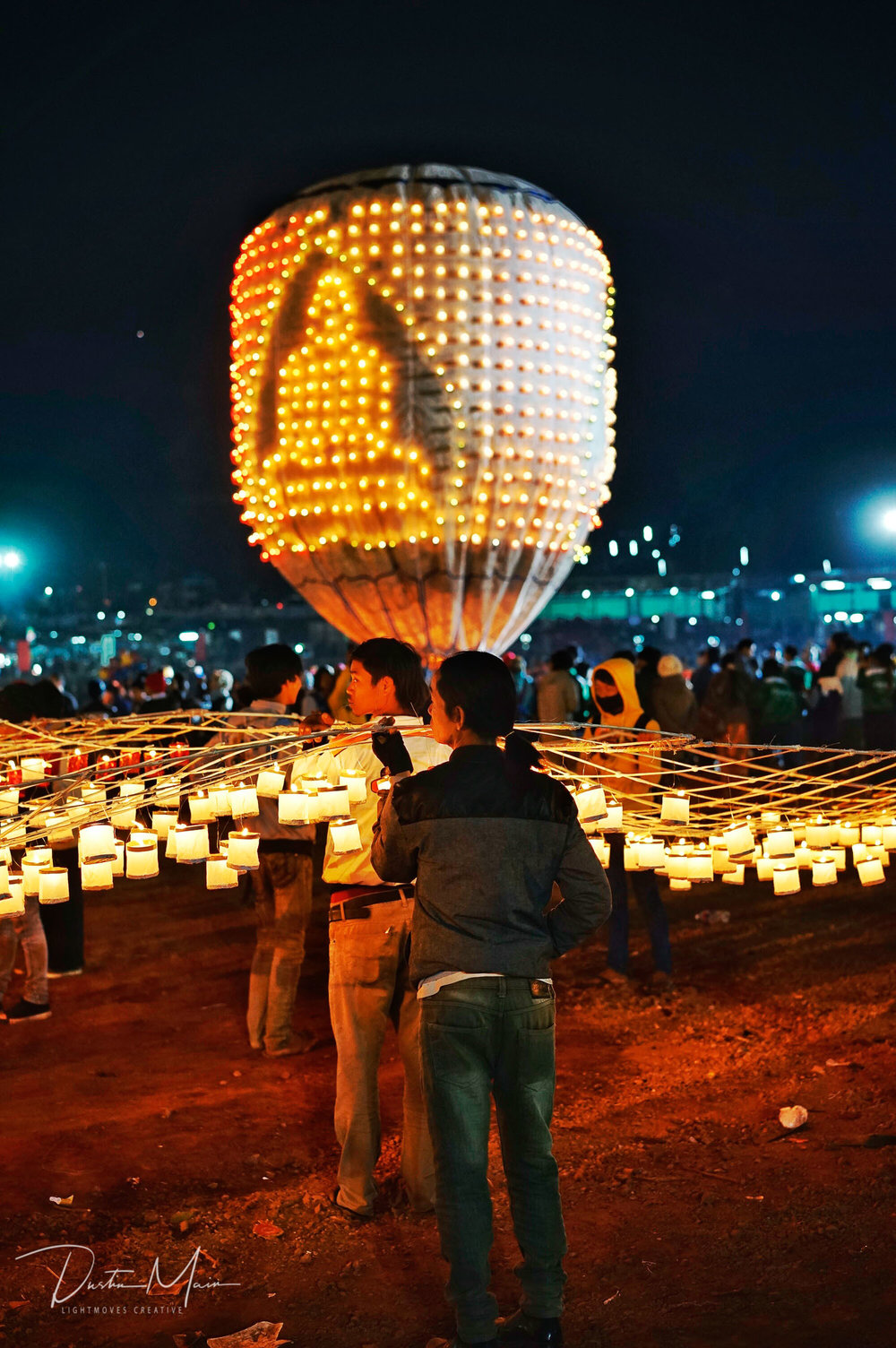  The candles on the fire balloon make the shape of a Buddha.  © Dustin Main 2016 