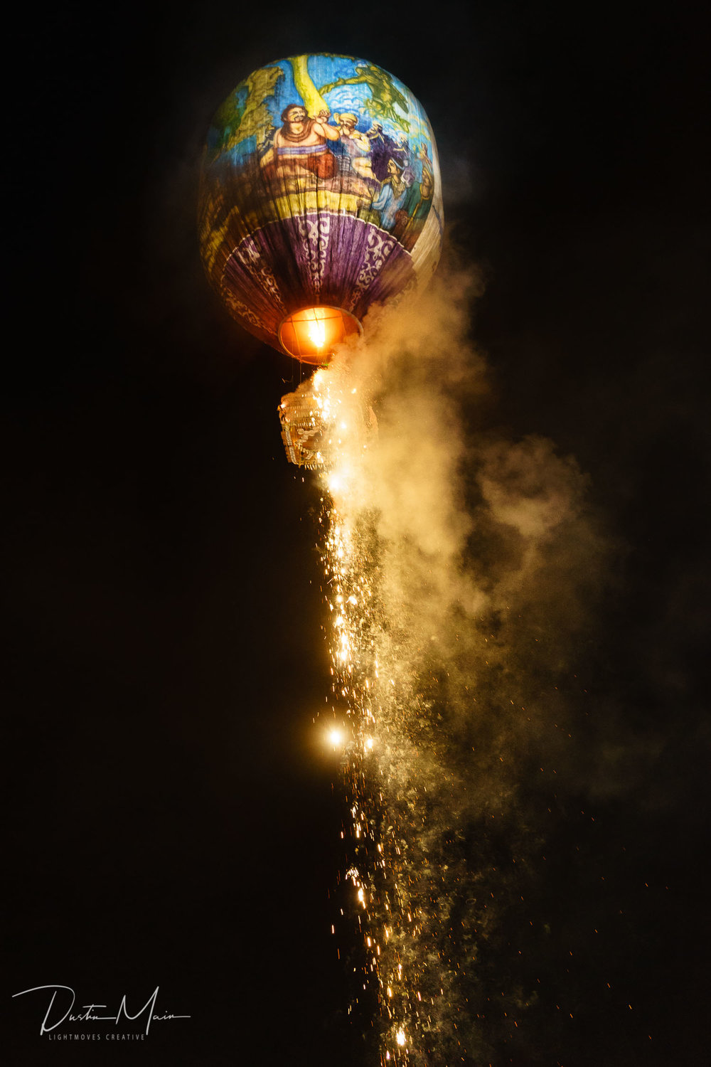  The fireworks on a fire balloon in Myanmar begin to go off.  © Dustin Main 2015 