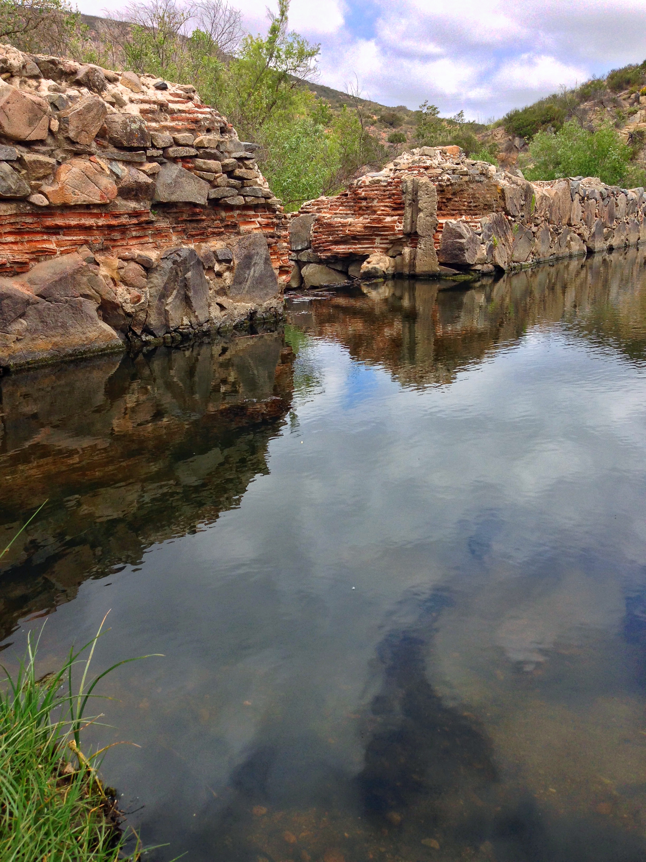 The Old Mission Dam near Kwaay Paay Peak is a great spot for reflection and history.