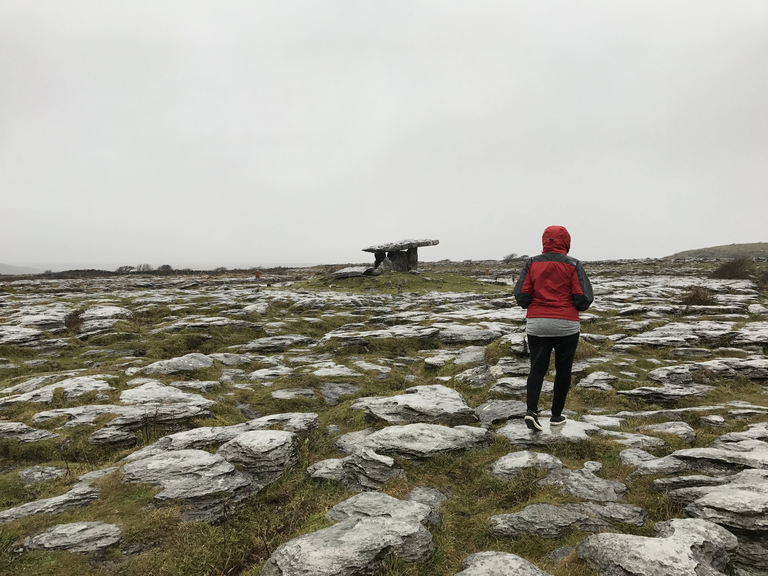 To visit Poulnabrone, visitors must traverse a short section of the rocks of the Burren.