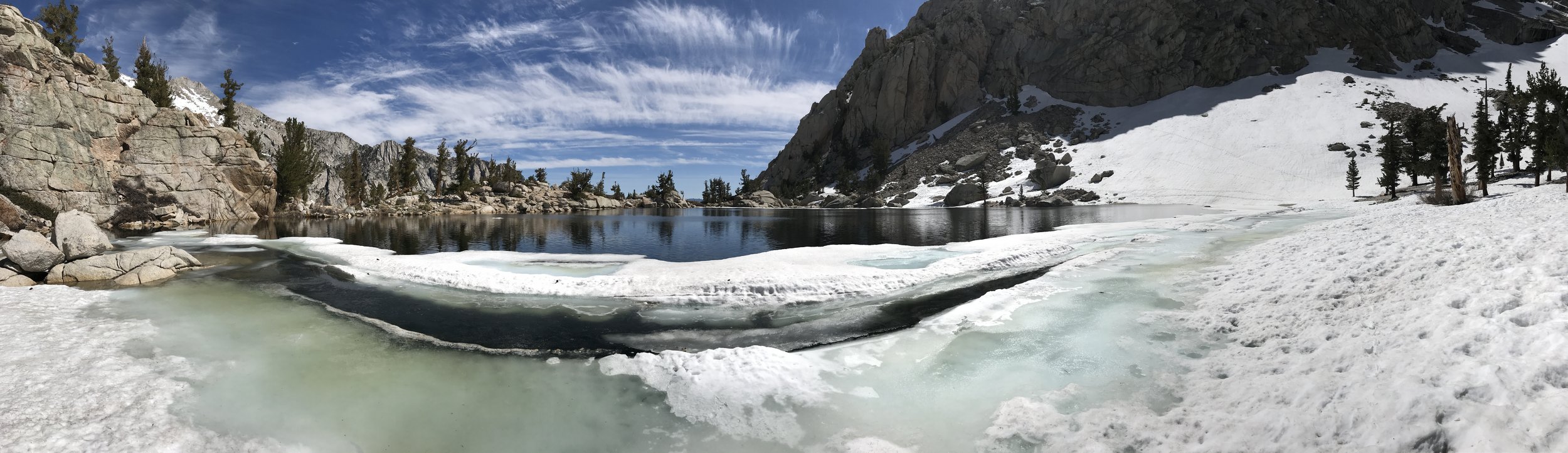Lone Pine Lake appears to stretch off into infinity as its far side drops off.