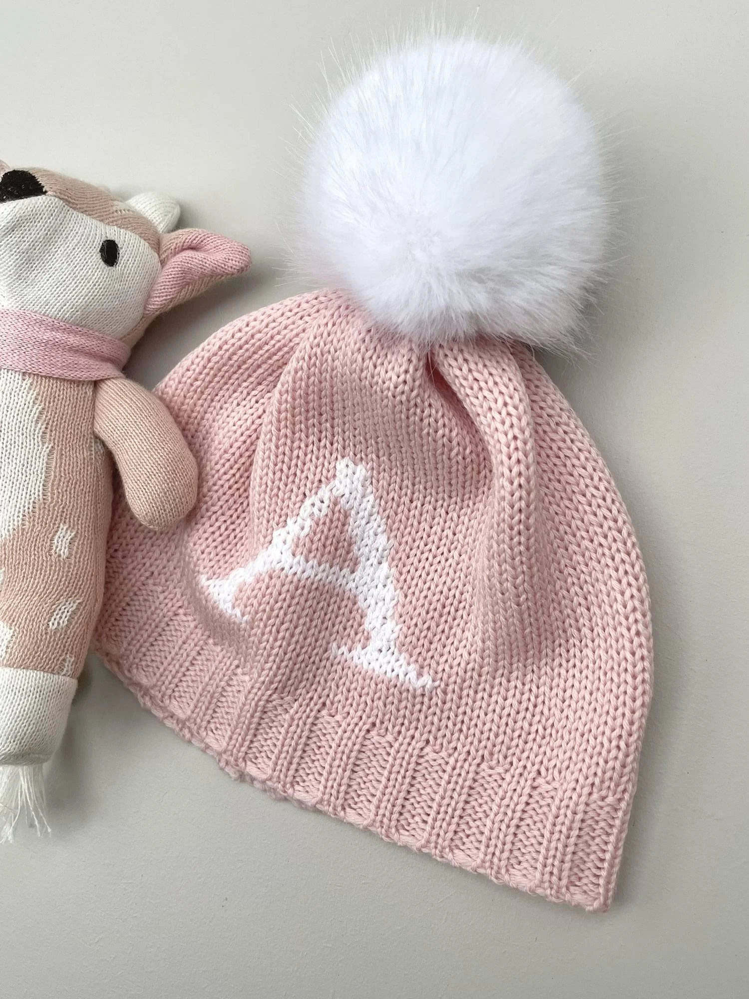 baby girls pink knitted monogram beanie