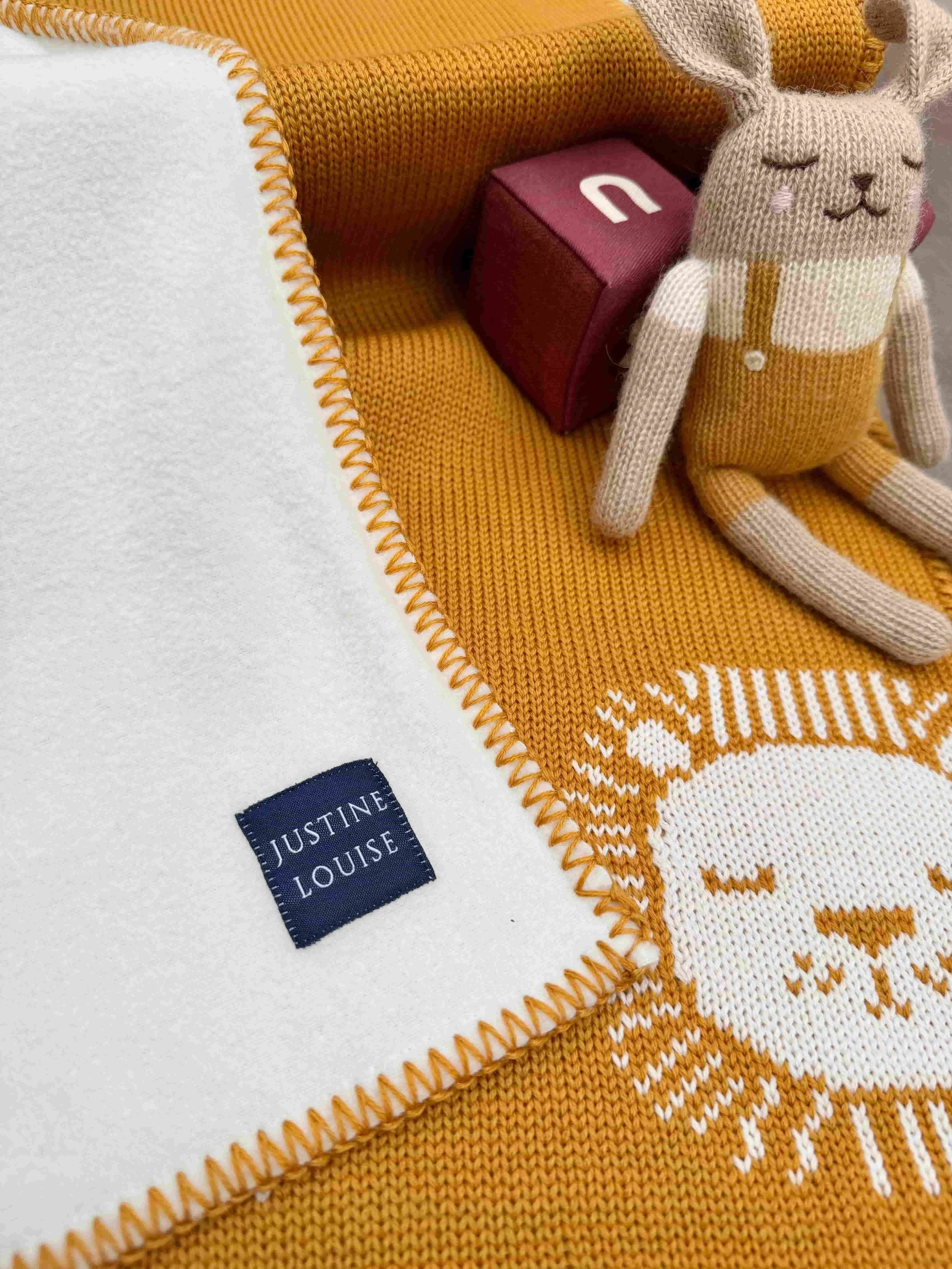 merino knitted lion baby blanket