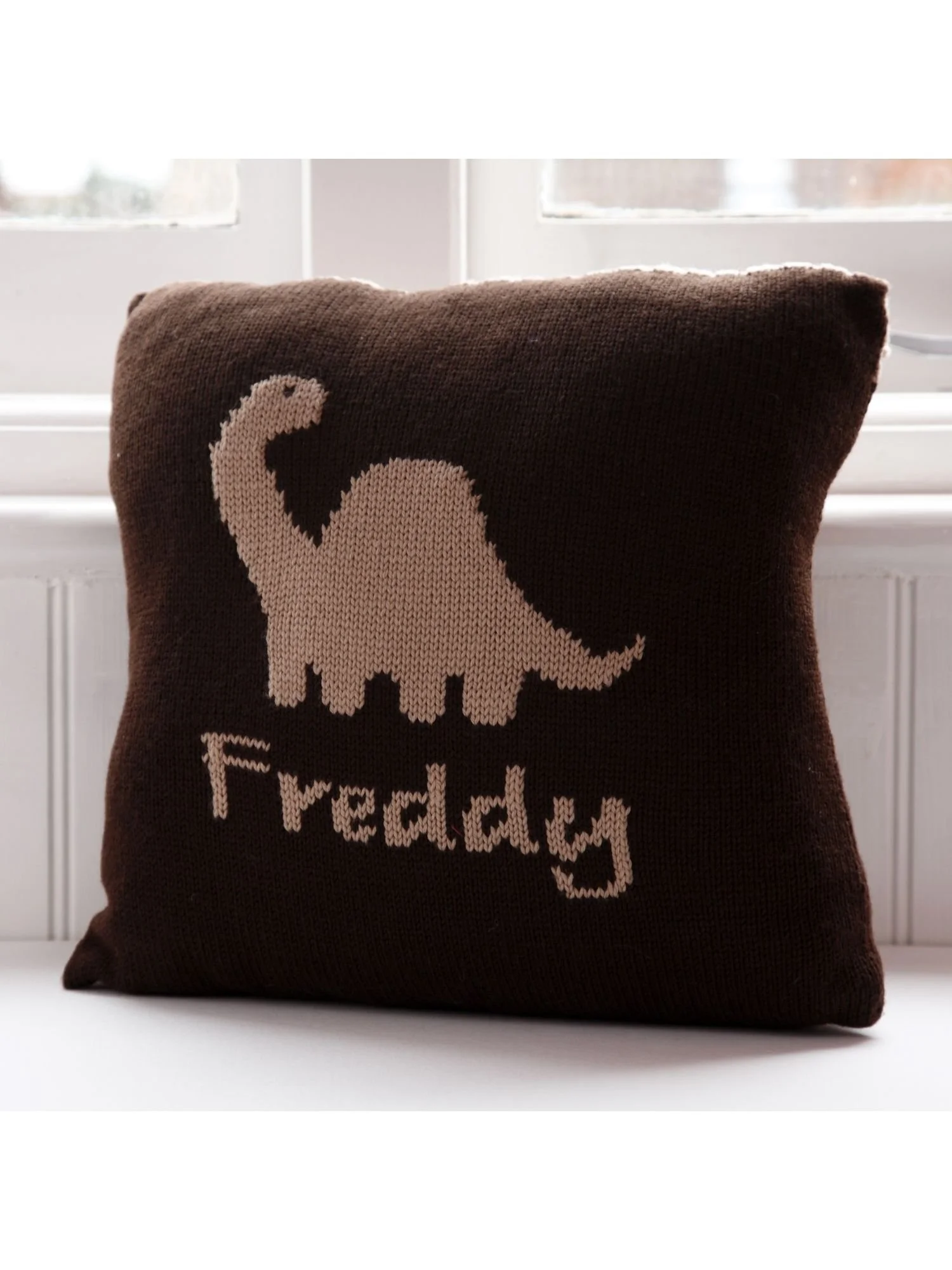 dinosaur cushion personalised in dark brown