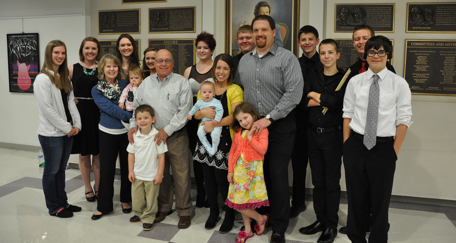 Photo with Heidi White's parents, Wilma and Alan McLauglin; Heidi's sister, Summer & her husband Matt, and their children; and some of the concert performers from MJHS and MHS. Picture was taken at the 2014 Heidi White Memorial Concert at the Bertha Frank Performing Arts Center. 
