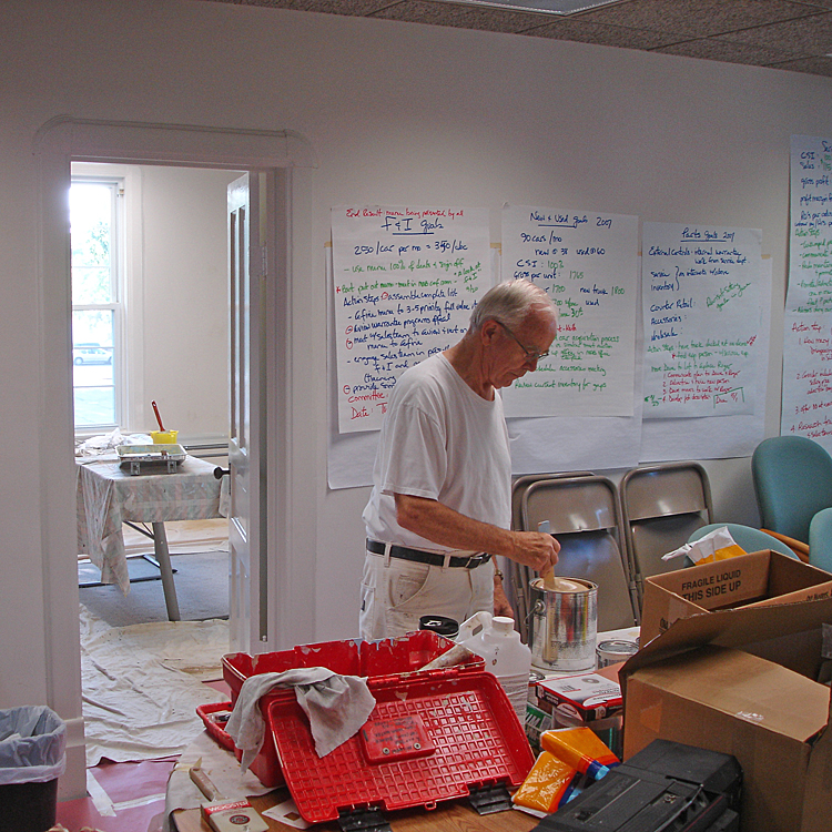  Harold Witzig helping paint the first MCF Office at 309 N Main, Suite B. 
