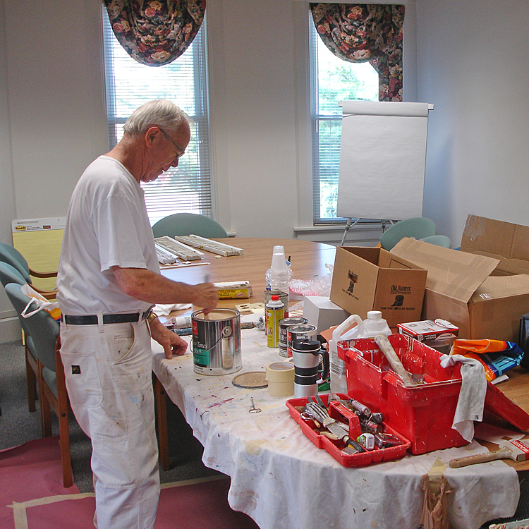  Harold Witzig helping paint the first MCF Office at 309 N Main, Suite B. 