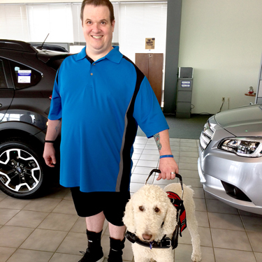 Todd and his service dog, Charlie.