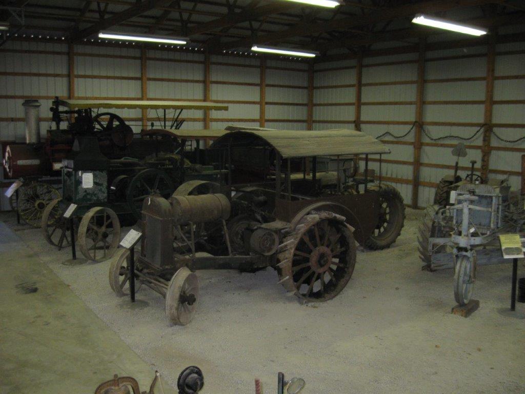 Early tractors and steam engine.jpg