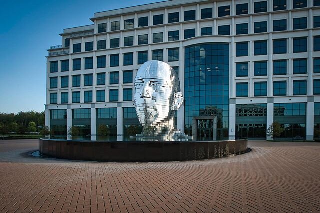 Metamorphosis by David Cerny in Charlotte, North Carolina. This is a moveable metal head that is controlled by computer. According to the website www.metalmorphodis.tv it is currently disassembled. This is from my archives. 
#clt_metamorphosis #photo